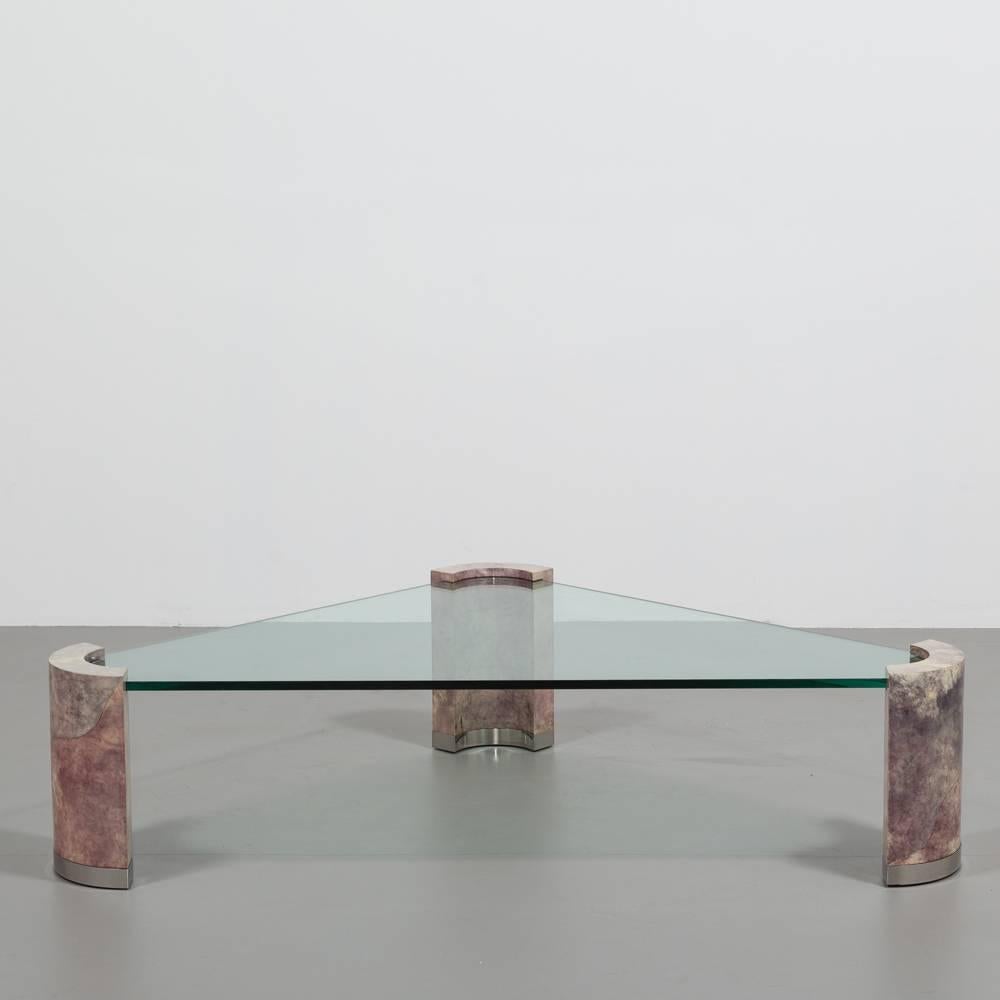 Karl Springer style coffee table with lacquered lilac stained goatskin legs capped with brushed aluminium. The original curved triangular glass top is supported into the legs 1980s

Dimensions are approximate as the piece is in storage. Please ask