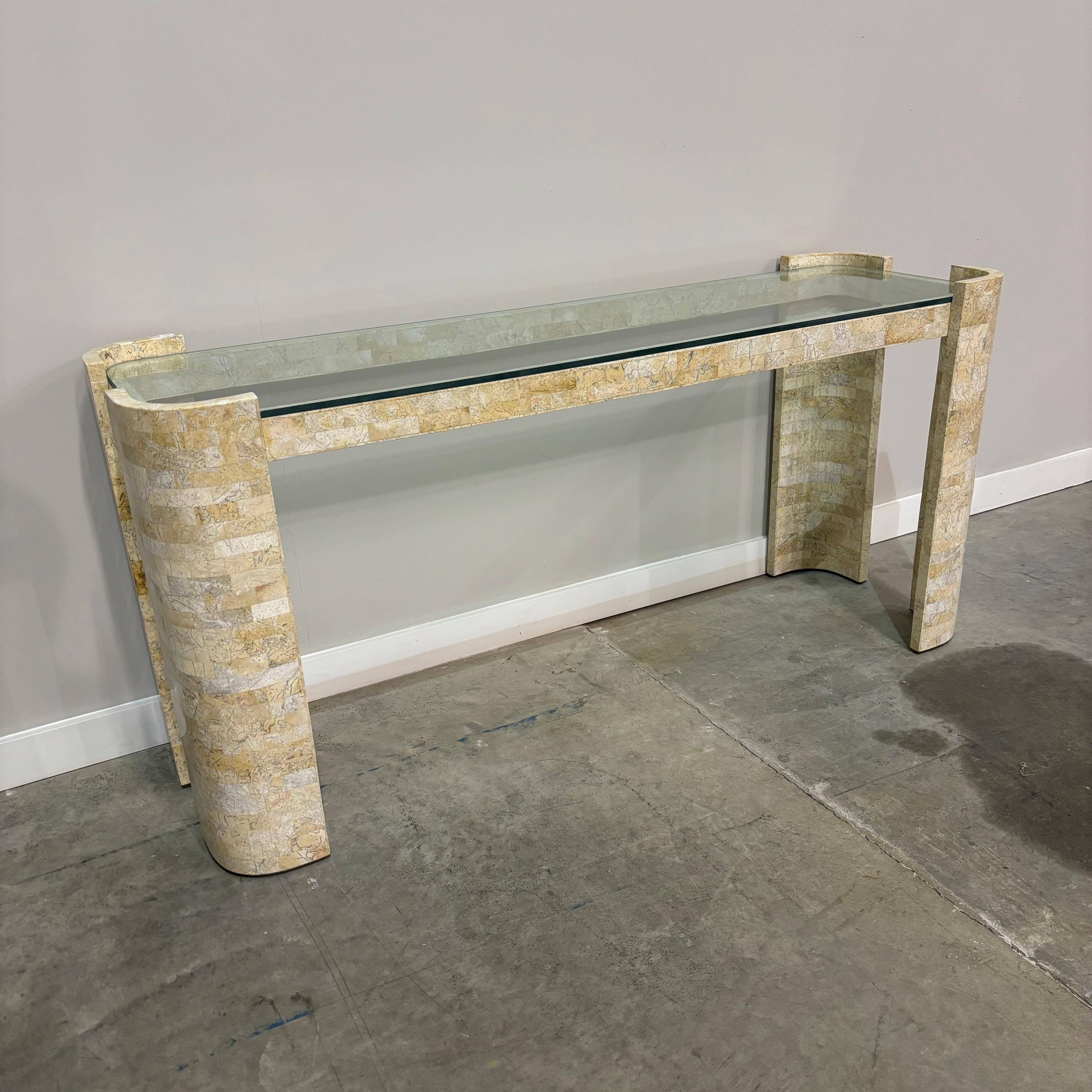 Tessellated stone and glass top console table dating to the 1970s.  In the manner of Karl Springer and Maitland Smith