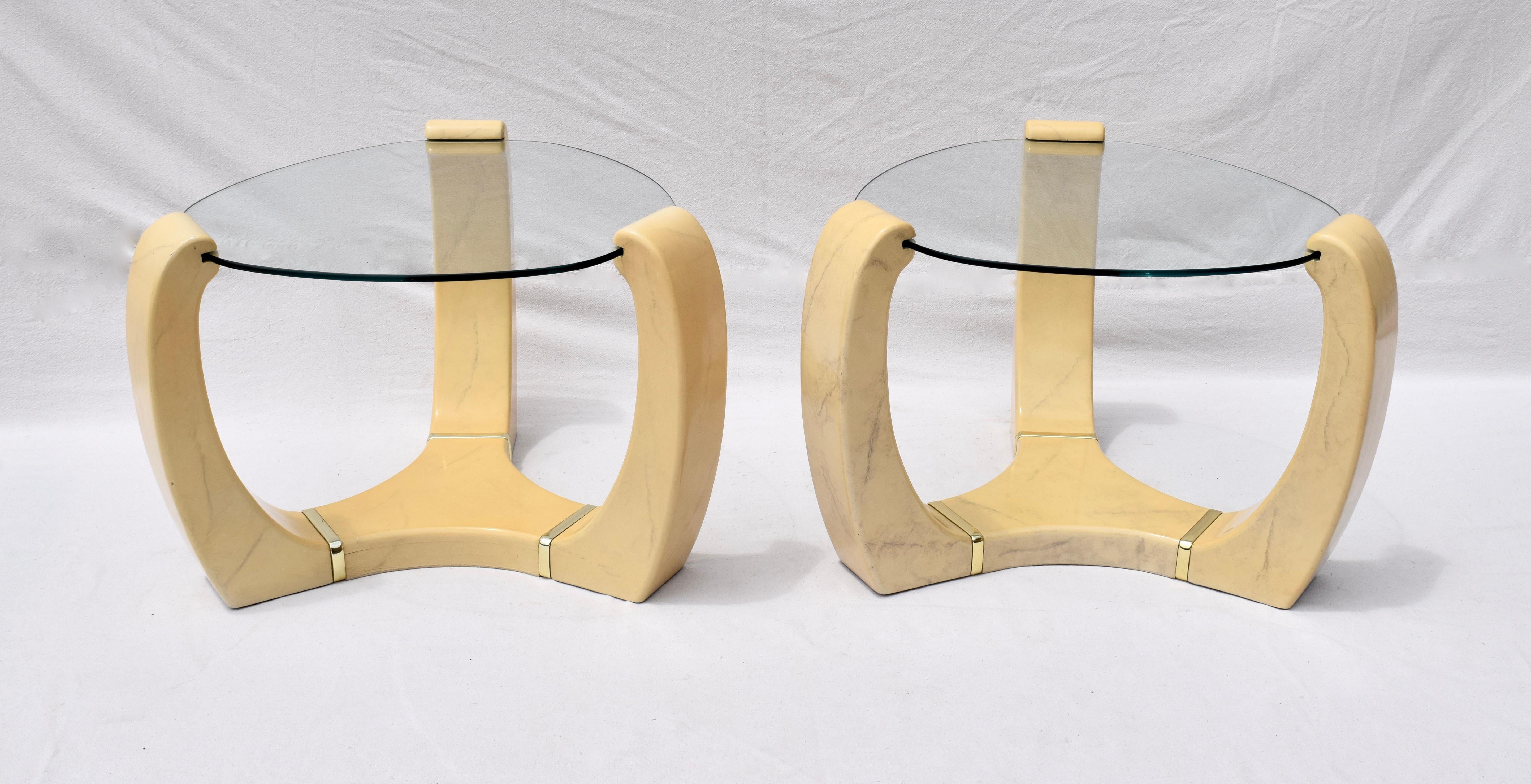 An especially unique pair of faux painted goat skin, glass and brass end tables in the manner of Karl Springer. Striking display in very nice original condition.