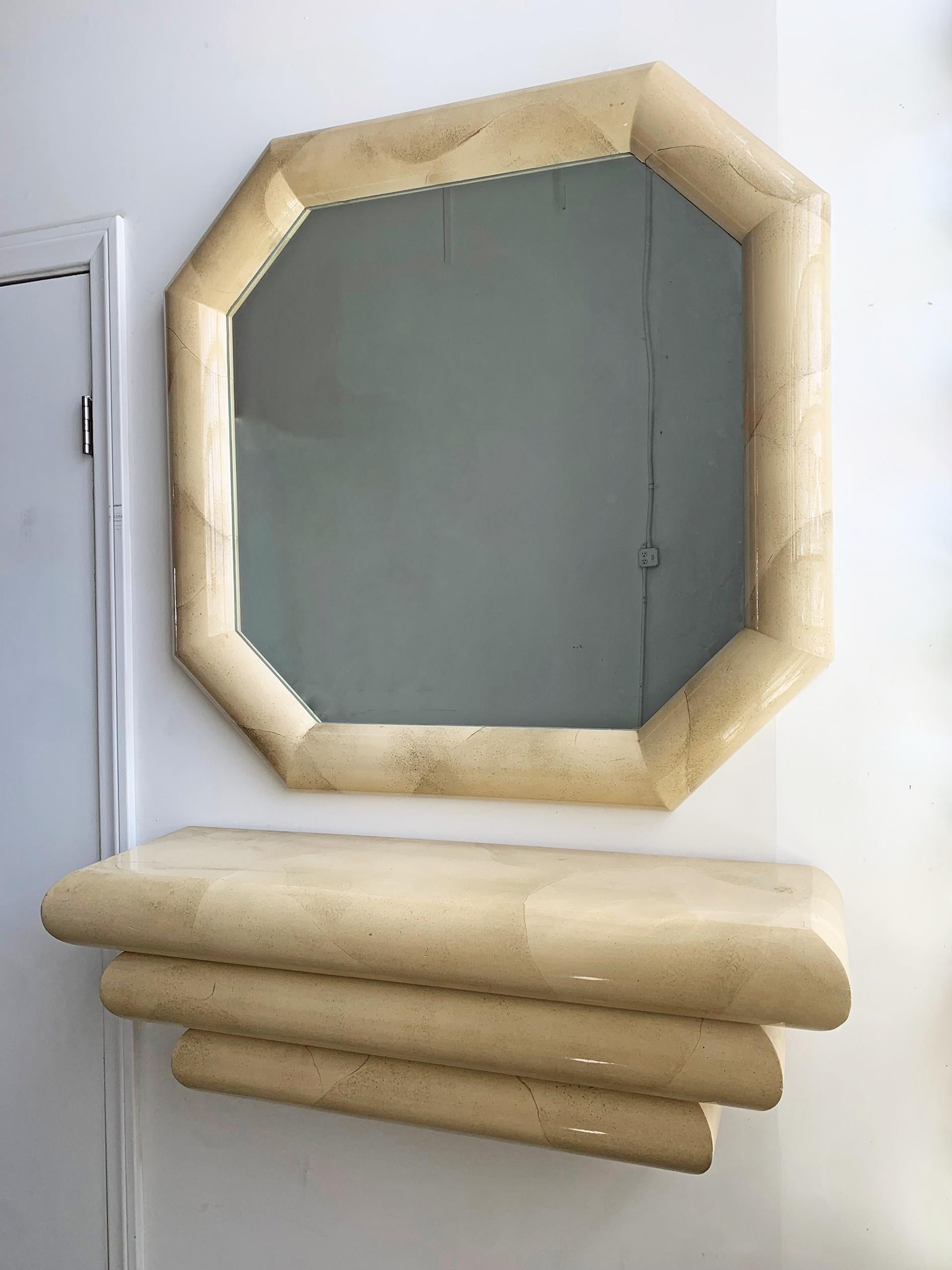 This 1980s mirror and matching console are simply stunning. The mirror bears a 