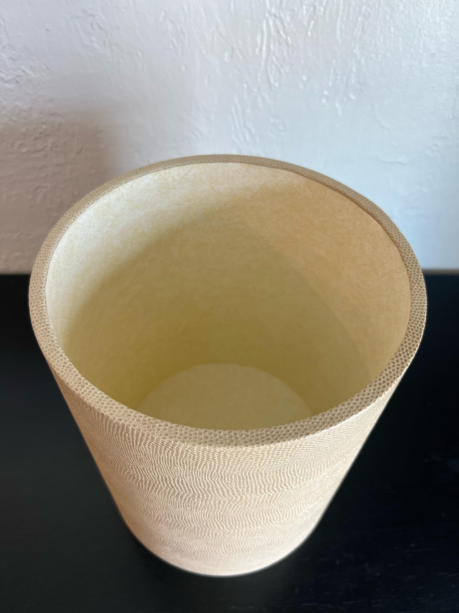 Karl Springer style faux lizard skin waste basket. Embossed faux lizard skin in a neutral beige tone. 

Would work well in a variety of interiors such as modern, mid century modern, Hollywood regency, etc. Piece blends seamlessly with other