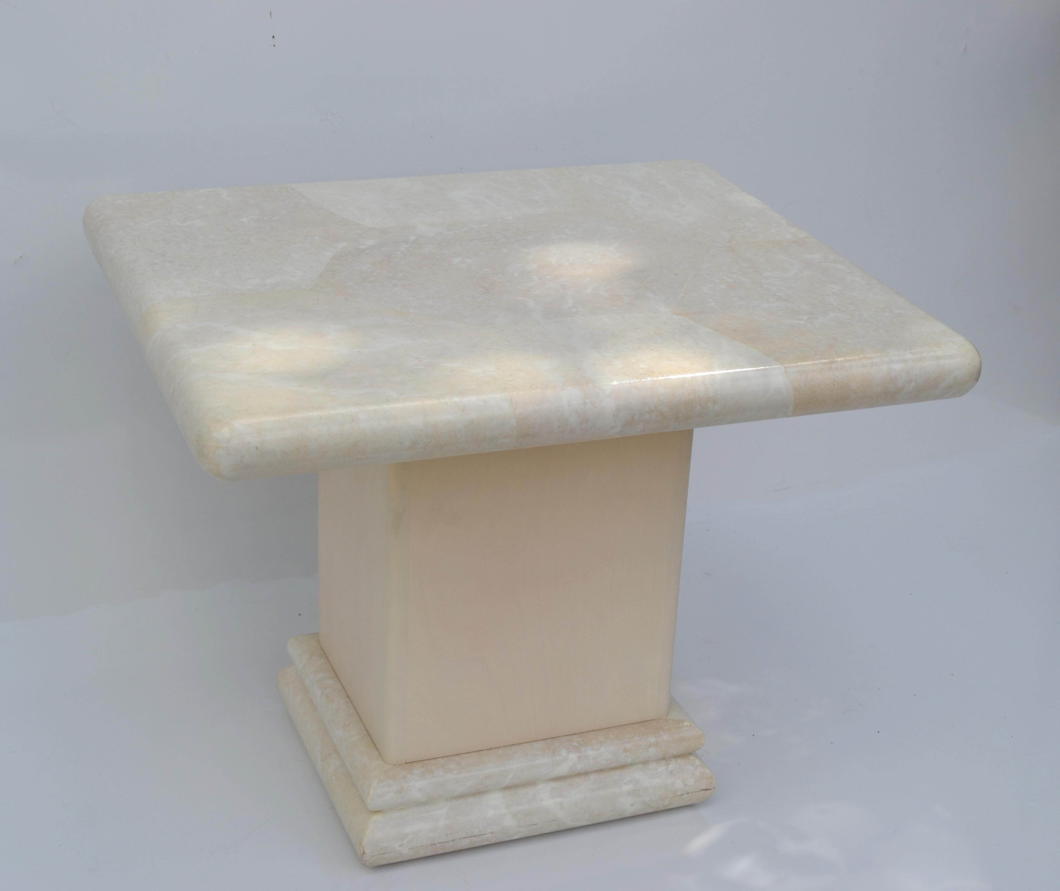 Superb Karl Springer Style ivory faux shagreen coffee table made in America in the 1980.
Very heavy and features a wooden pedestal with a rectangle Top.
Good vintage condition with some light wear due to use and History. 
Base measures: 15 x 13 x