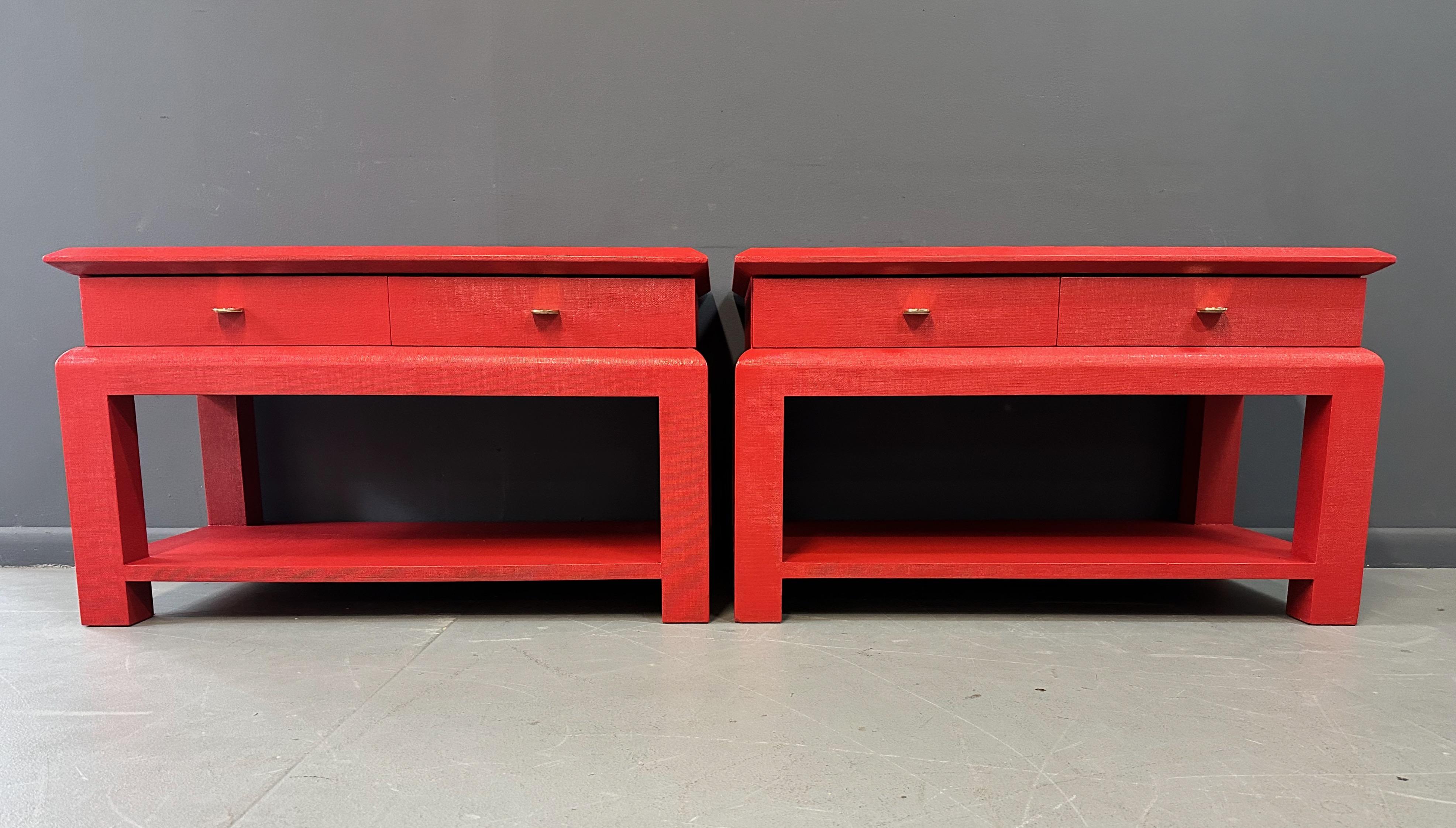 Rowdy in Red!! These wonderful end/side tables raffia wrapped and lacquered in a extraordinary Chinese red, these tables will make a statement in any room. With generous proportions these tables have two drawers on top with really lovely understated