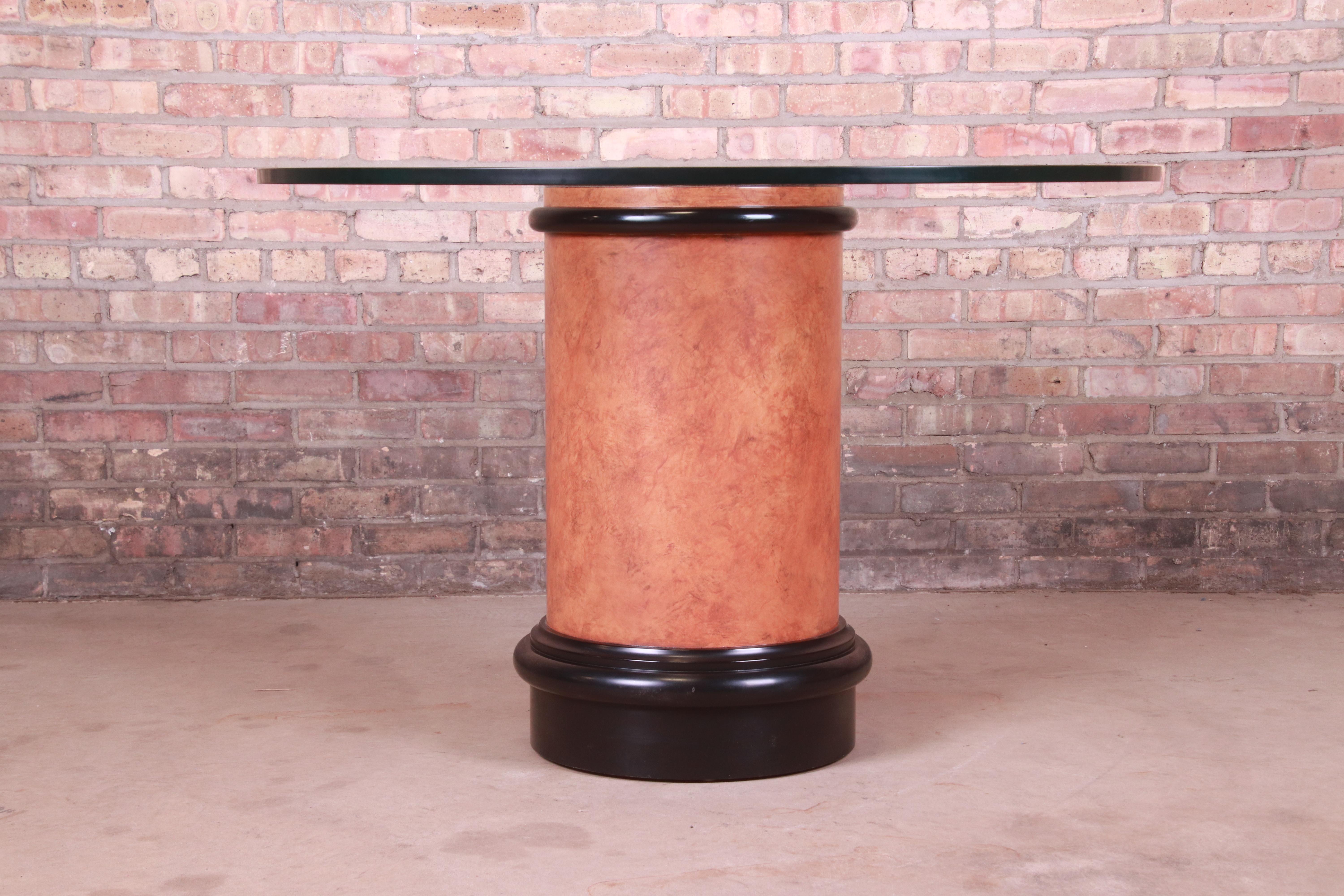 A gorgeous modern pedestal dining or center table

In the manner of Karl Springer

Circa 1970s

Burl wood and black lacquer pedestal base, with round glass top.

Measures: 44