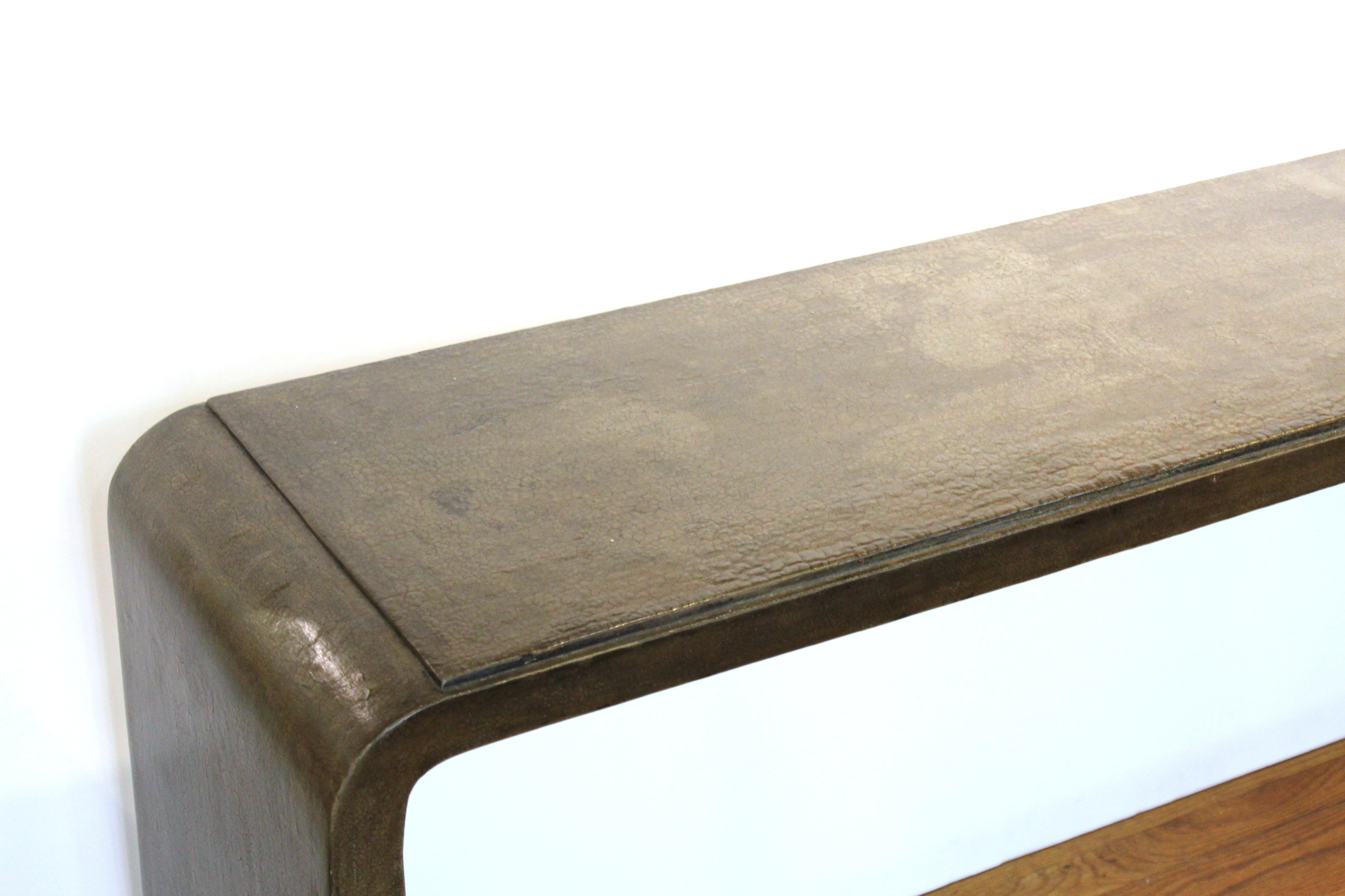 Karl Springer style modern lacquered console table with craquelure finish and rounded edges, circa 1970s.
From the Estate of designer, model, television host, and business woman, Nina Griscom.