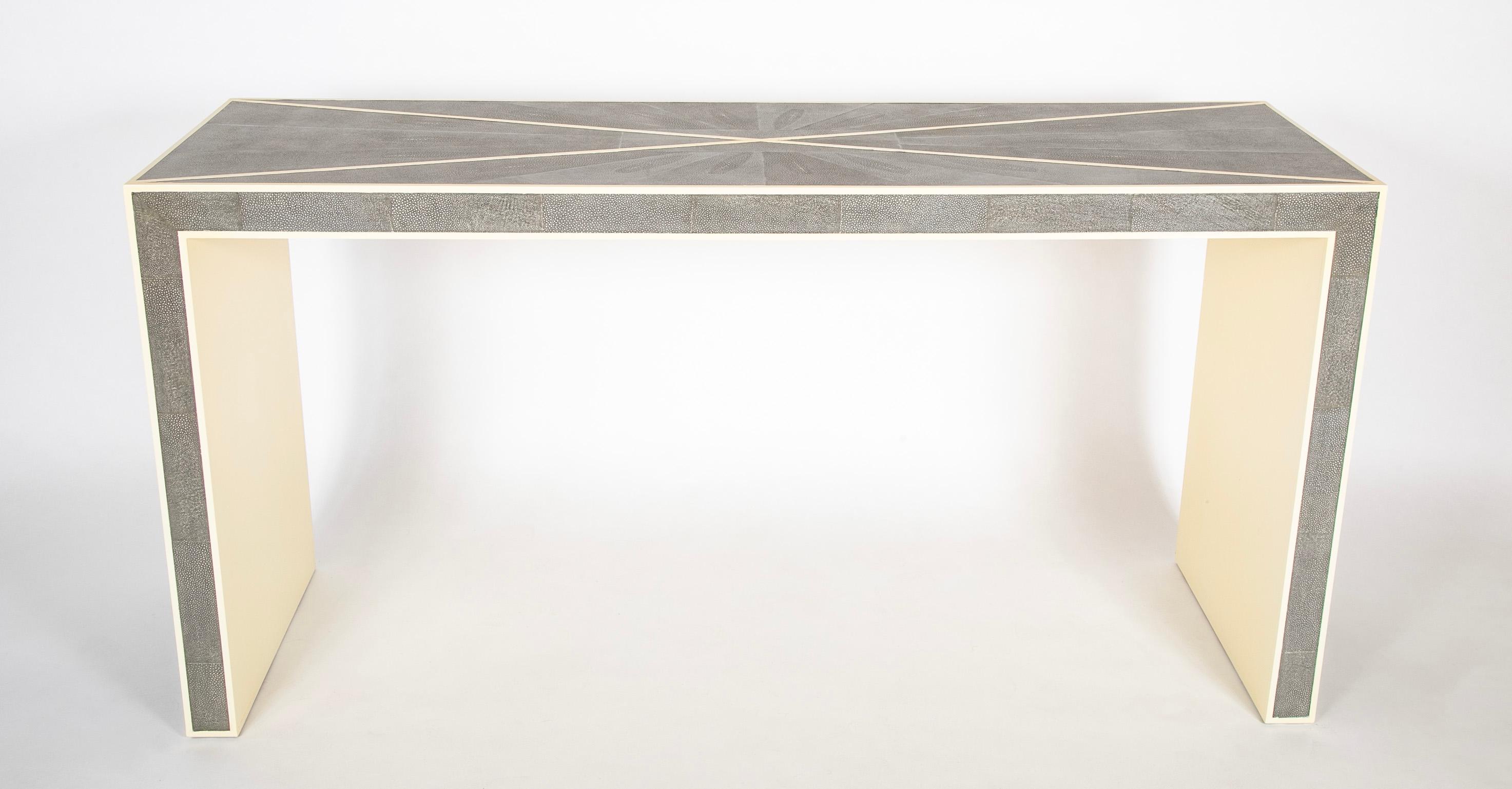 A stunning rectangular console table with triangles panels of shagreen veneer delineated by raised cream colored lacquer borders. This beautiful Karl Springer style console with make and entryway or foyer, or any other room it is placed in. Expertly