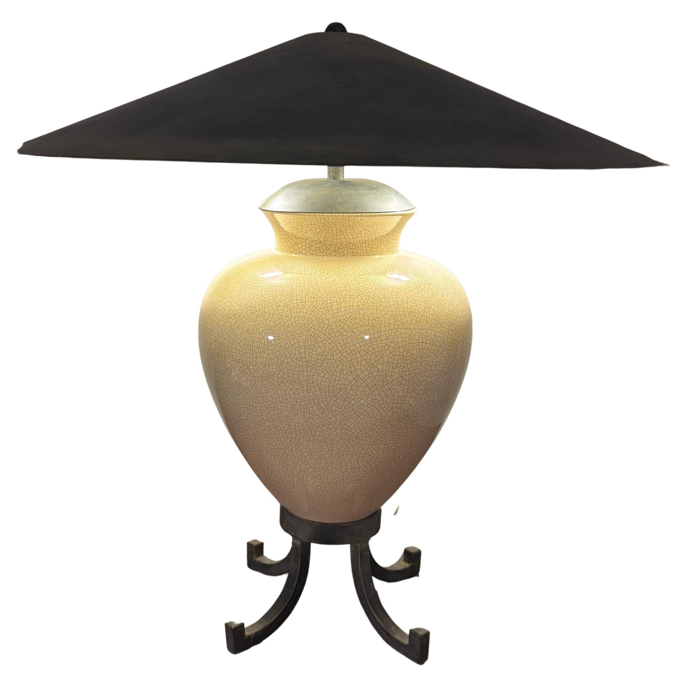 Handsome Asian inspired table lamp. Ceramic urn with a crackle glaze sat upon a metal base. Twin 60 watt bulbs covered by a wide metal shade. 

Metal shade has a foggy grey finish that matches the base. 

Karl Springer inspired. 

Lamp in total is
