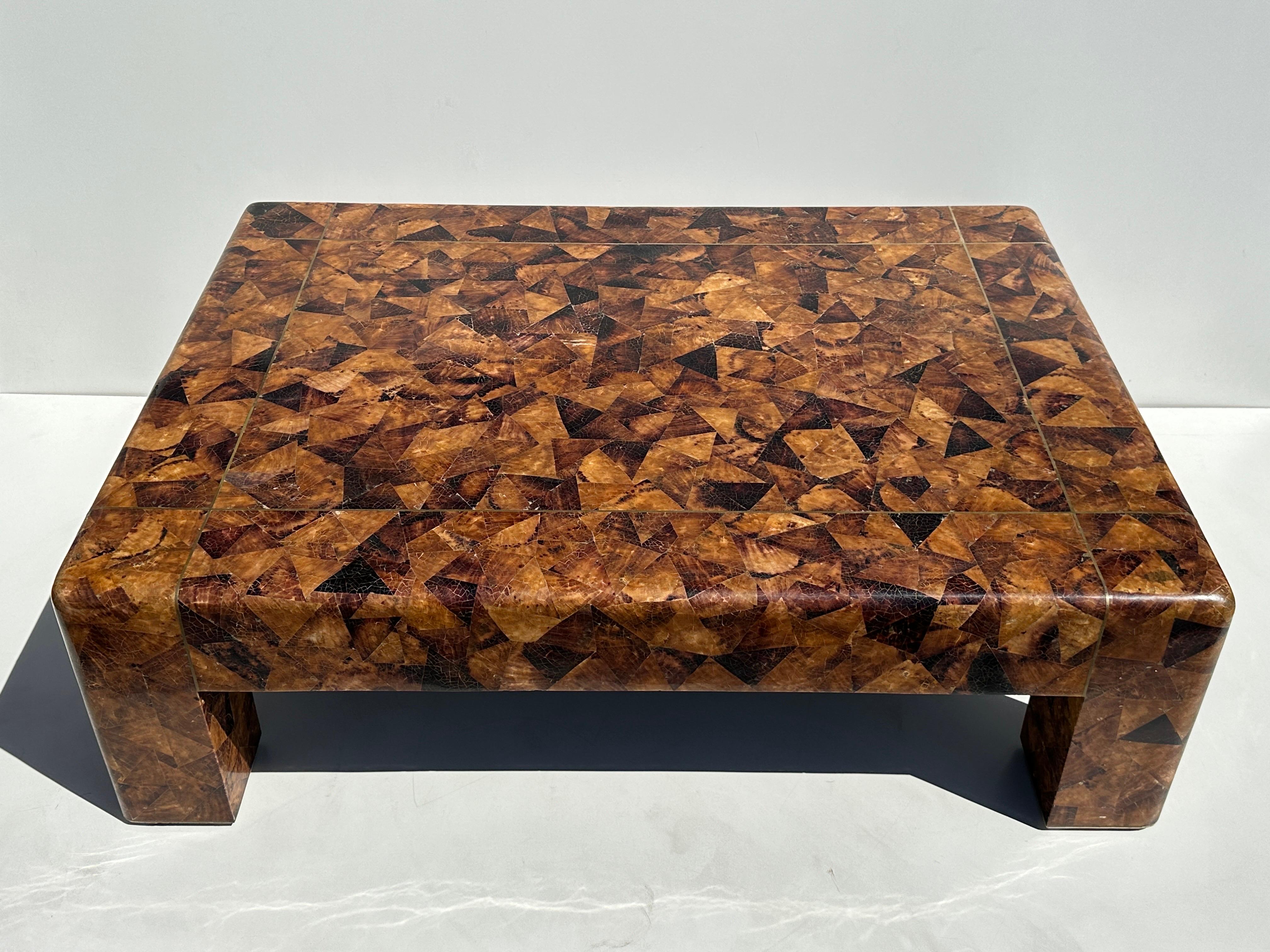 Karl Springer LTD tessellated penshell coffee table with brass trim.