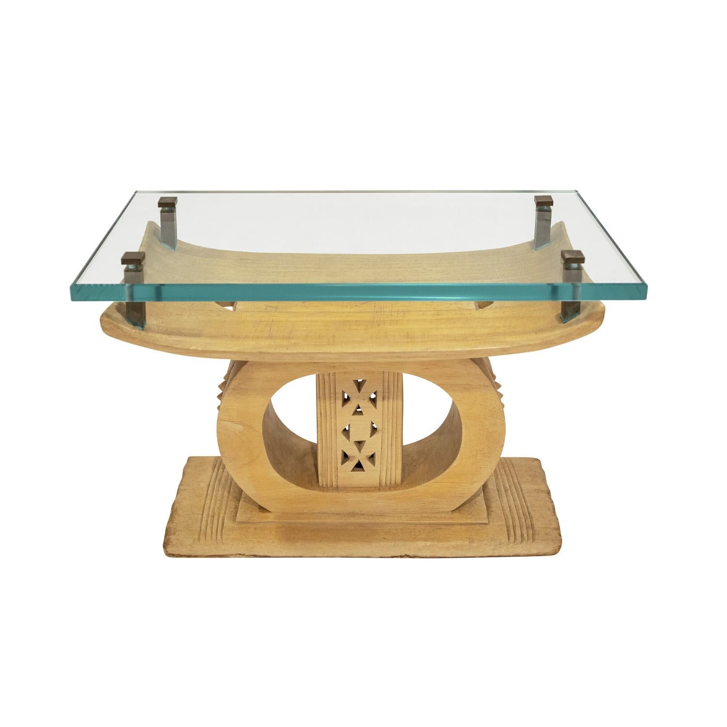 Unique table with an authentic African hand carved bench with added artisan bronze fittings and thick custom glass top by Karl Springer, American 1970s. Karl Springer was adept at taking beautiful genuine artifacts and modifying them with his own