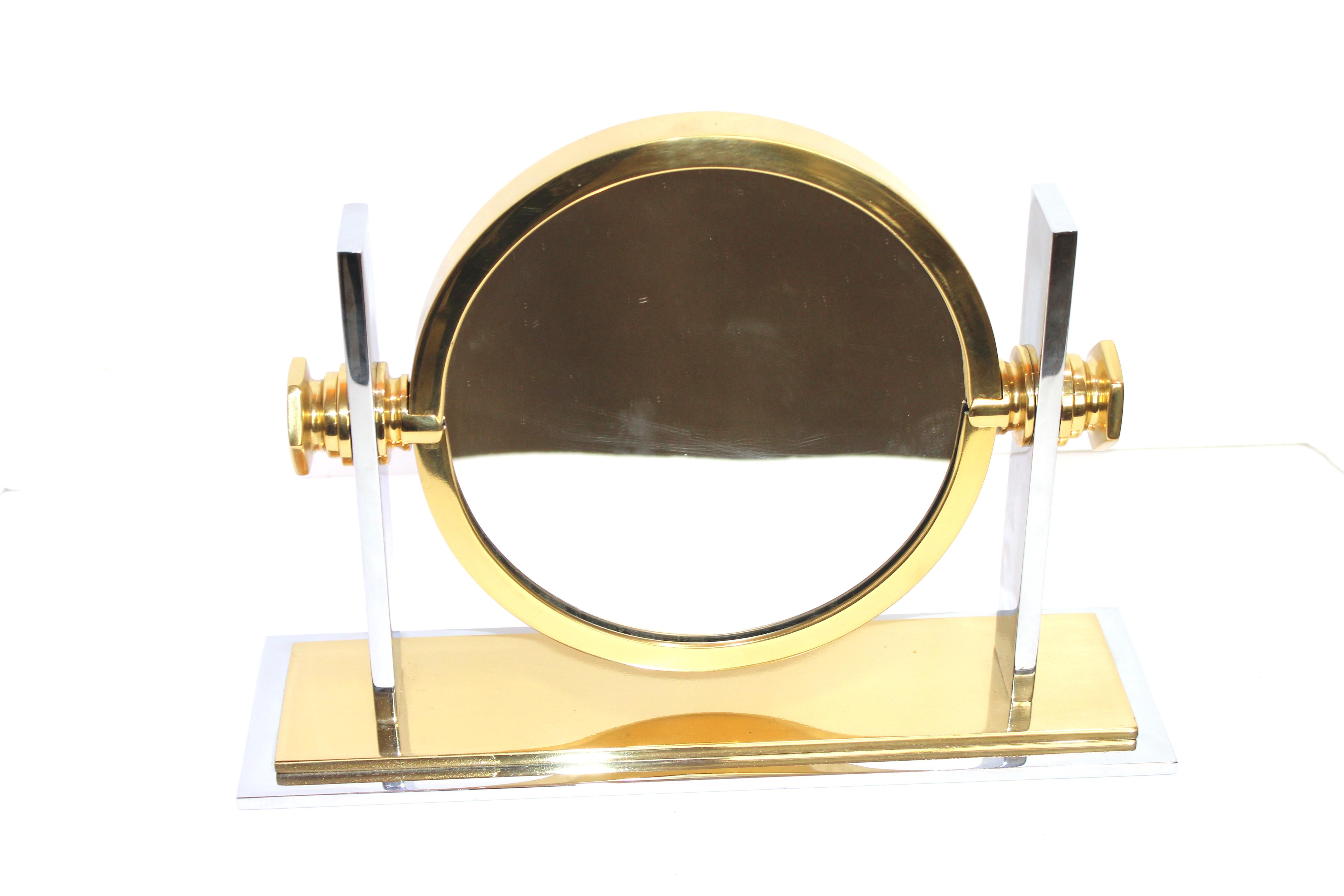 This stylish and chic adjustable vanity table mirror was created in the 1980s-1990s by Karl Springer and was recently acquired from a Palm Beach estate. 

Note: The piece is fabricated in chrome and brass plated steel and mirror. 

Note: The