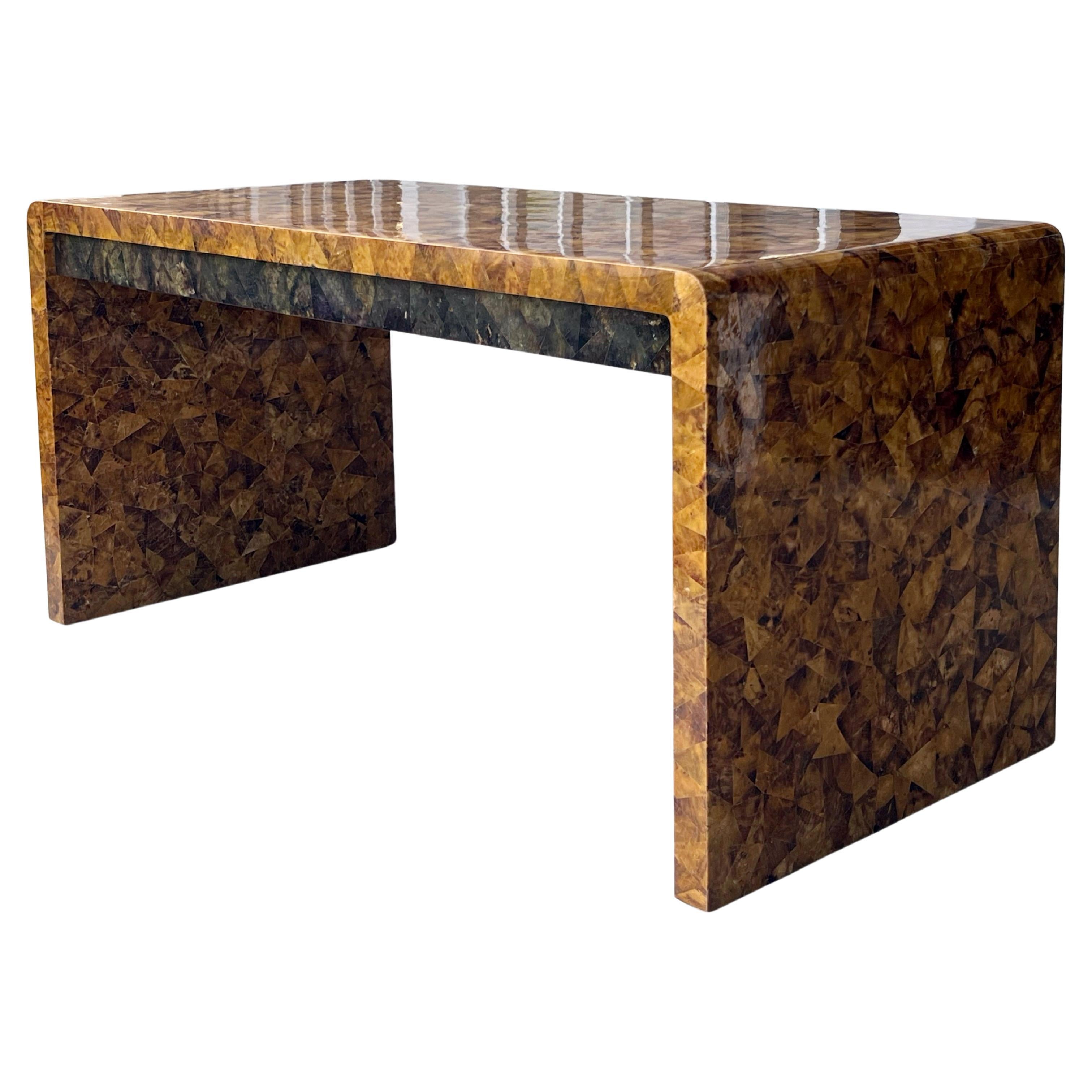A Karl Springer desk in Tortoise color Pen-Shell with 3 recessed drawers. 
Signed with brass plaque. 