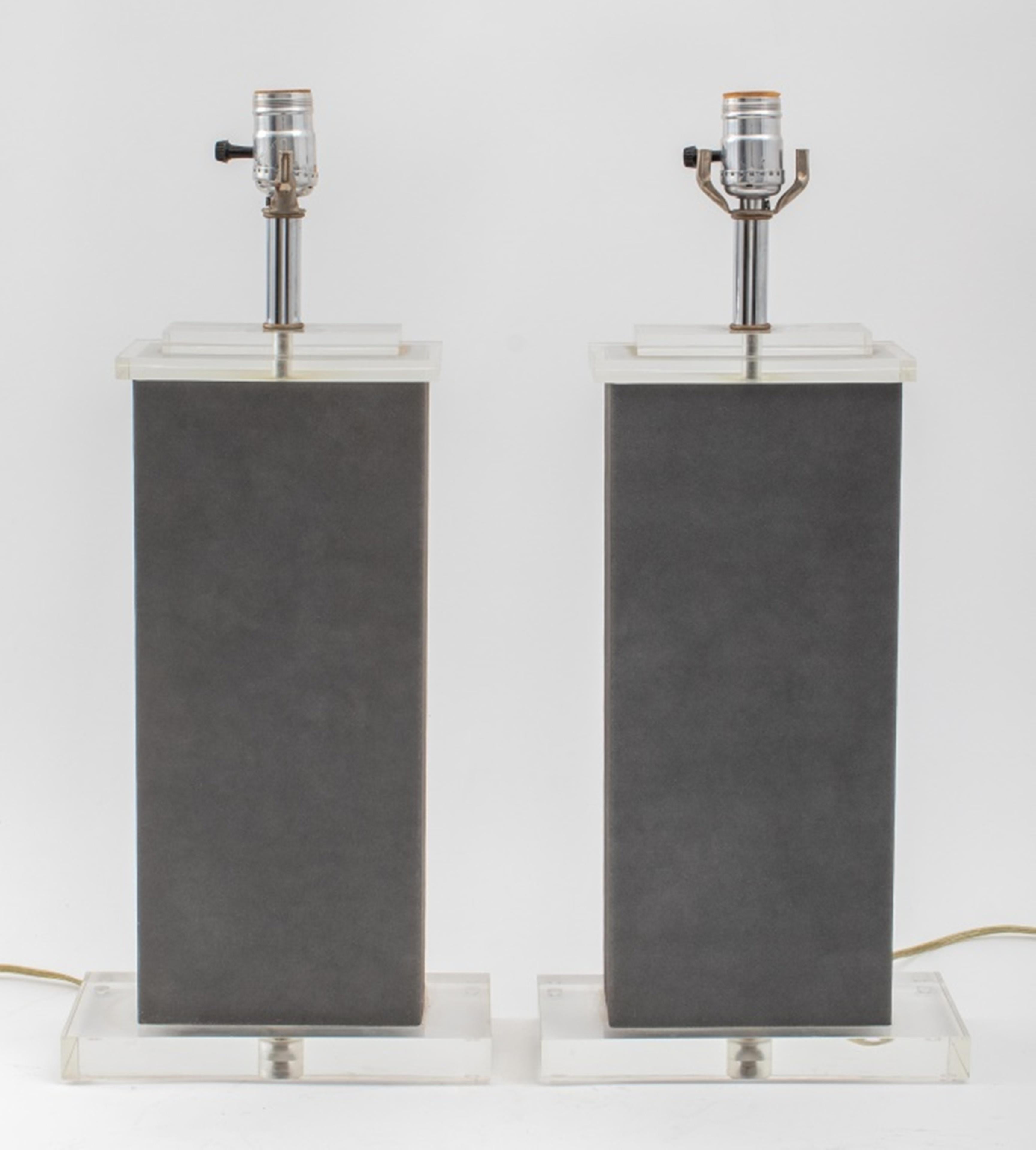 Karl Springer (German-American, 1931 - 1991) pair of modern rectangular base table lamps enveloped in gray textured laminate with stacked Lucite elements, circa 1980s. 21.5