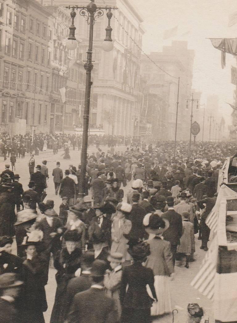 New York City Parade by Karl Struss is a vintage photograph documenting a crowd of people in the streets of New York City during a parade. 
This photograph is a vintage gelatin silver print, measuring 4 x 3 inches, with the mat measuring 17 x 14