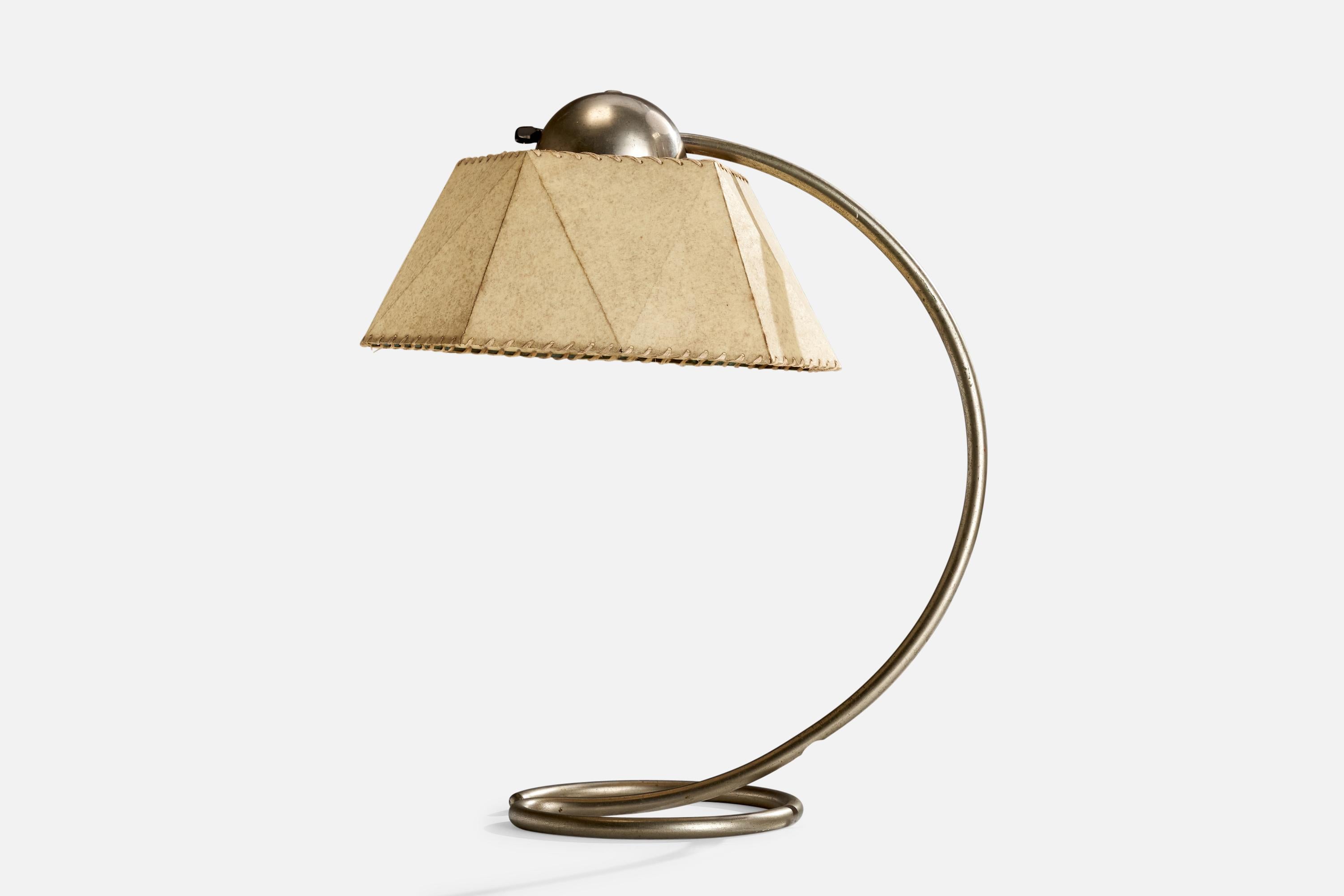 A nickel and parchment paper table lamp designed by Karl Trabert and produced by Schanzenbach & Co., Frankfurt am Main, Gemany, c. 1930s.

Dimensions of Lamp (inches): 18.5” H x 12.375” W x 8.125” D
Dimensions of Shade (inches): 7” Top Diameter x