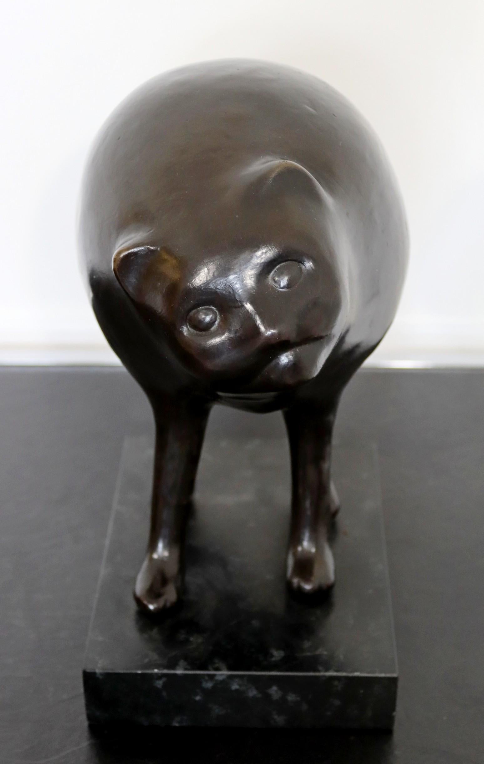 For your consideration is an amusing bronze sculpture depicting a small round kitten by Kalamazoo, MI based artist Karla Wyss Tye. 


Dimensions: 11.5 H x 8 W x 6 diameter in excellent condition.