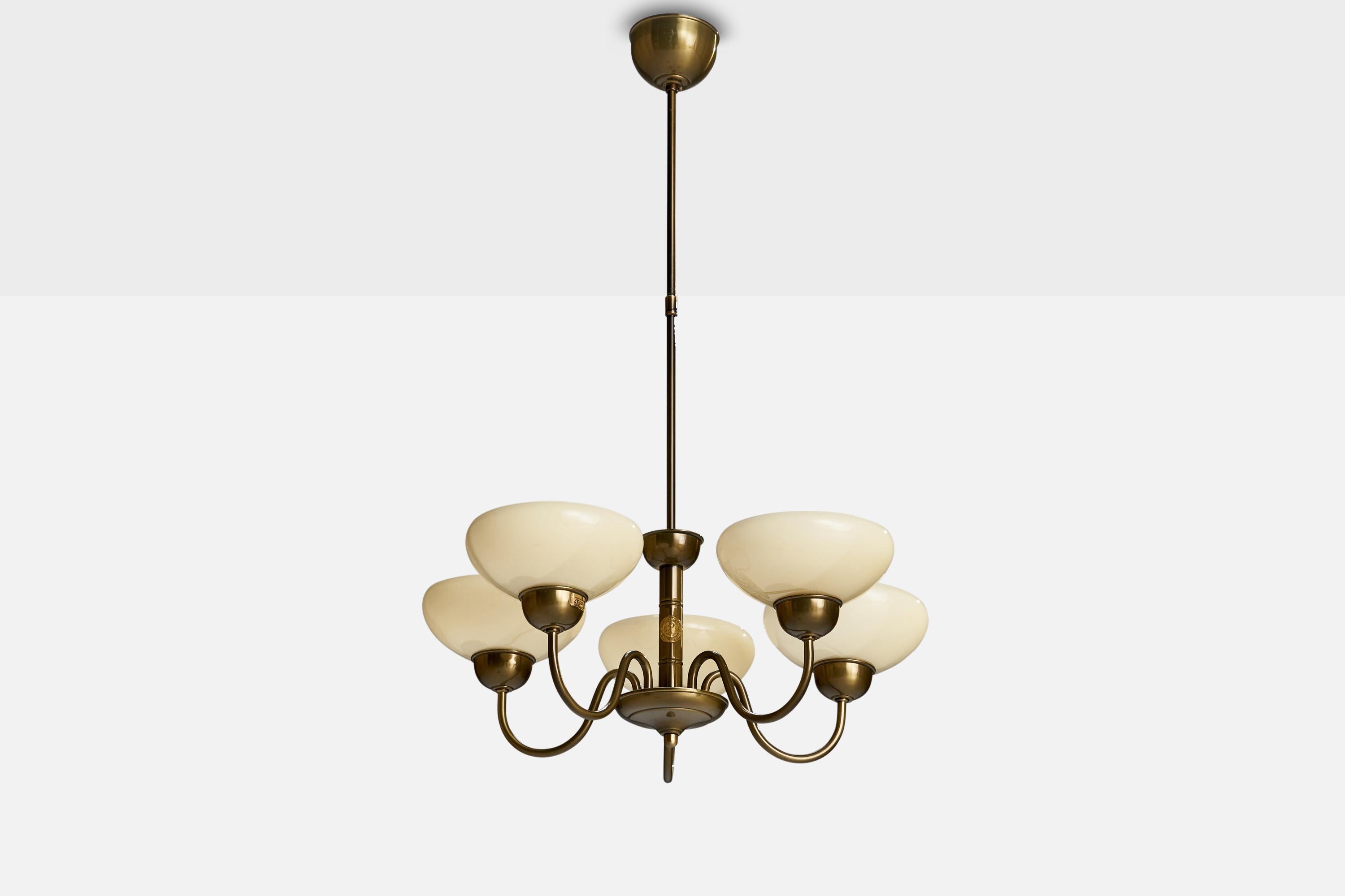 A brass and cream white opaline glass chandelier produced by Karlskrona Lampfabrik, Sweden, c. 1970s.

Dimensions of canopy (inches): 3.07” H x 4.19” Diameter
Socket takes standard E-26 bulbs. 5 socket.There is no maximum wattage stated on the