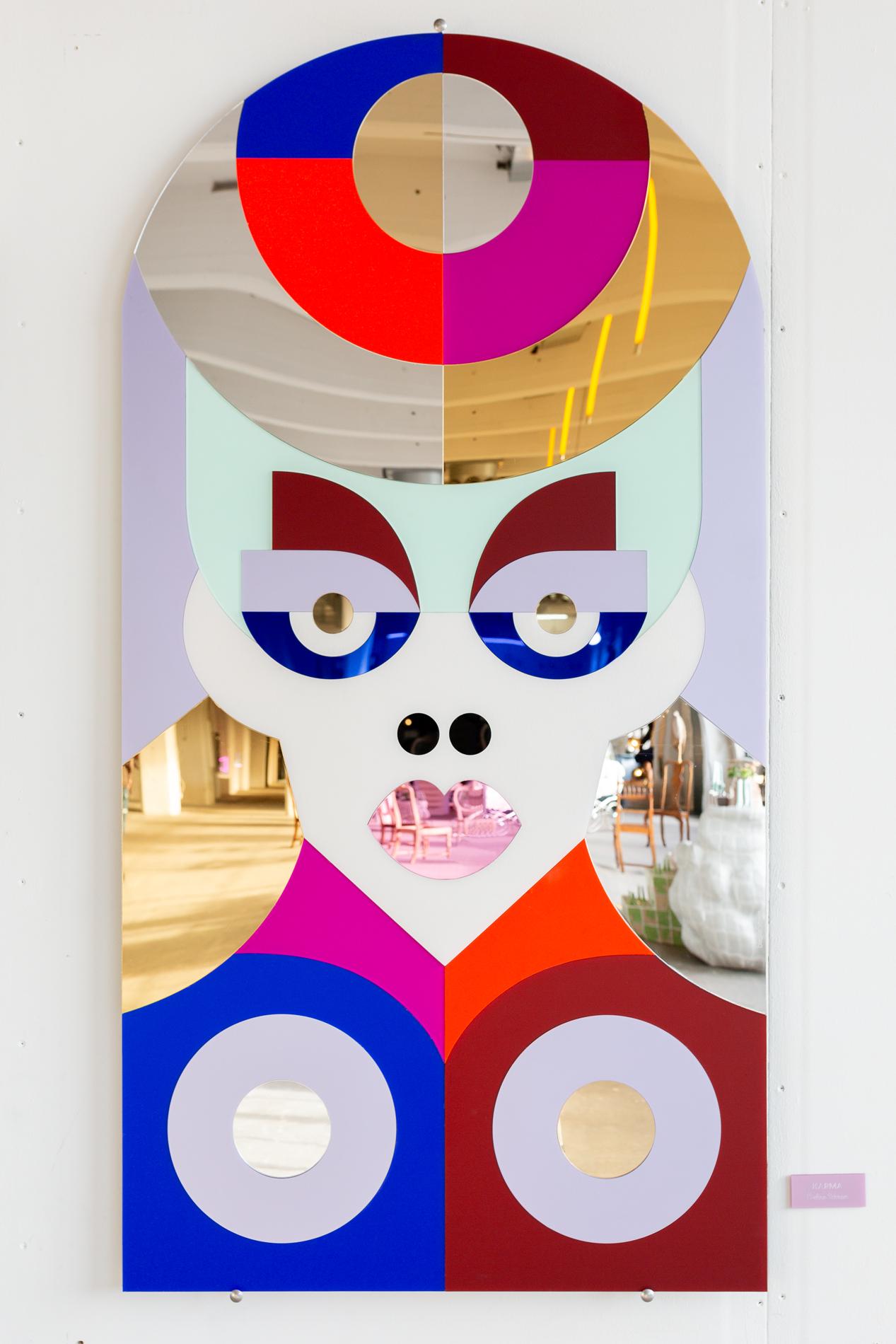 Karma is a 150cm tall colorful mirror artwork designed and created by Eveline Schram. The work is entirely made of a diverse array of plexiglass materials, including reflective colored mirror-, frost-, metallic- and stonelook surfaces. The piece can