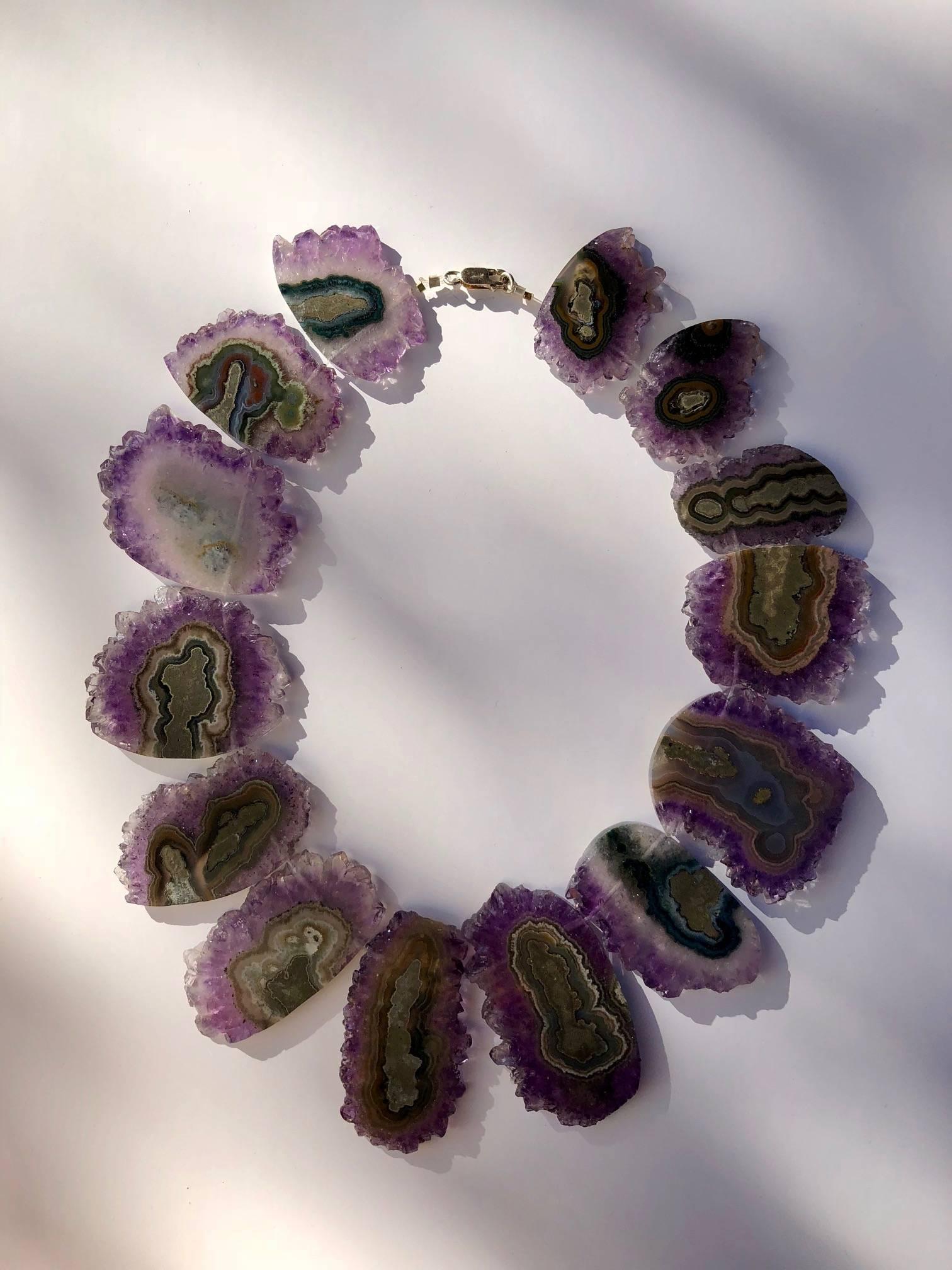 'A beautiful piece of art, that's what this is!'
Made of natural Amethyst, not colord, this necklace completes your outfit.
The selection is carefully made and the shape is amazing around your neck.