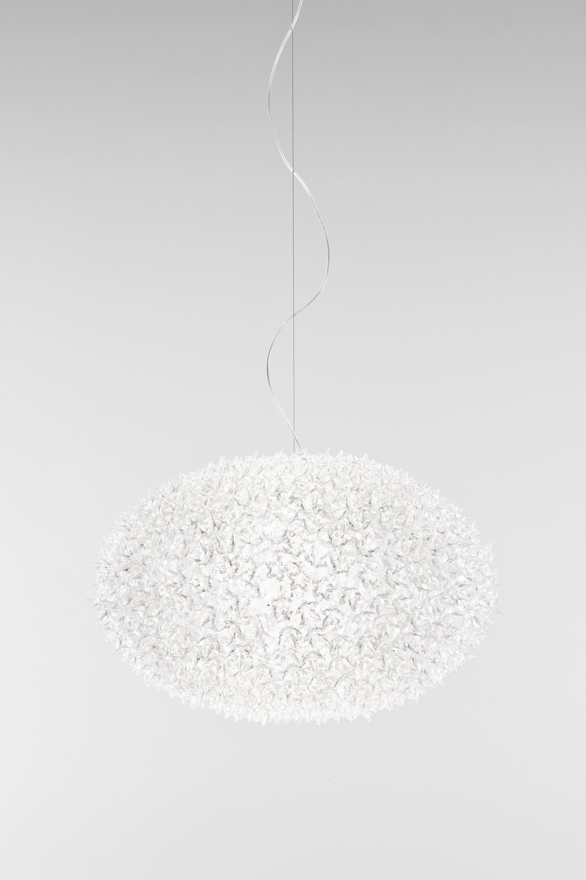 Bloom is a tubular polycarbonate framework entirely covered by a structure of tiny transparent polycarbonate double corolla flowers. The result is an industrially produced lamp but with all the forms and stylistic complexity of a unique handcrafted