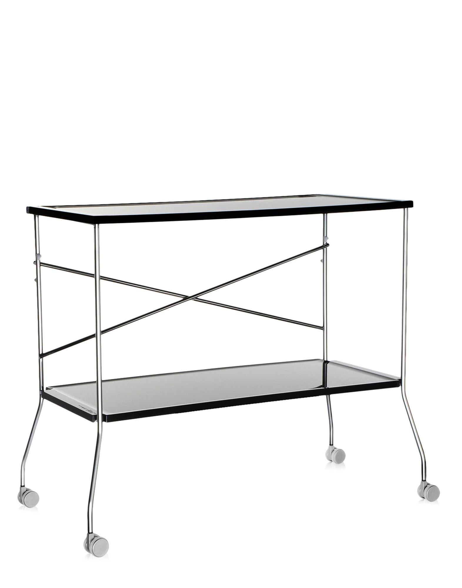 Kartell brings transparency to the world of trolleys too and thus we have flip, the folding trolley which combines the transparent plastic surfaces of the trays with a metal frame. The trays made of polymethylmethacrylate and can be used separately.