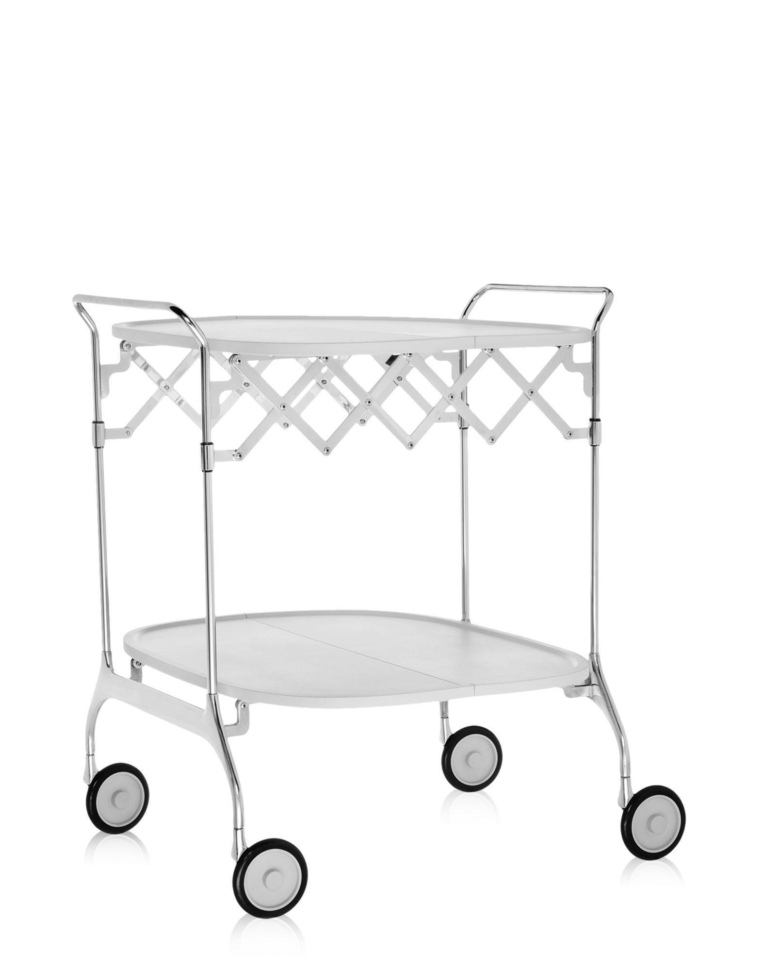 Gastone is an elegant and practical folding trolley with varnished plastic top surface and chromed steel support. The castors are a formal feature and ensure functional mobility. Once closed, it has a depth of 23 cm. It can be conveniently and