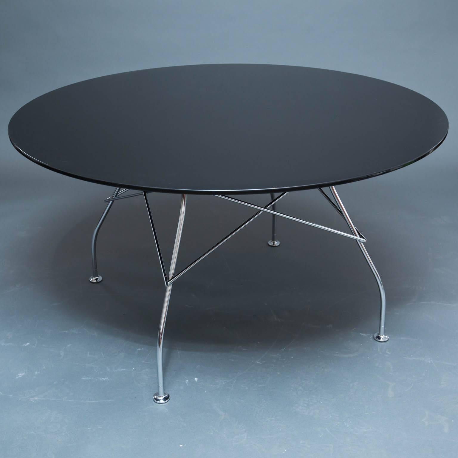 Nice modern table with chrome base and high-gloss lacquered top.