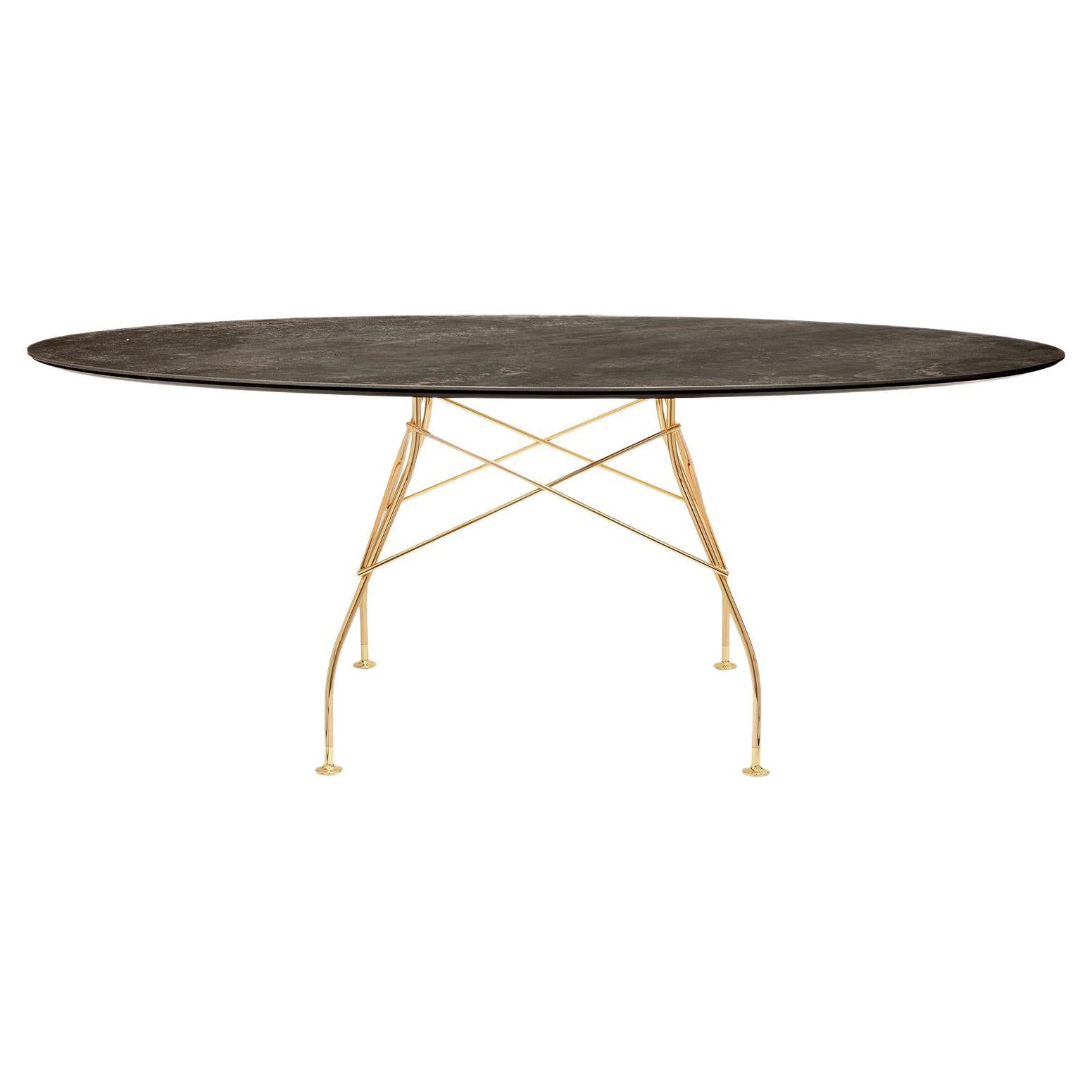 Kartell glänzender Tisch aus gealterter Bronze von Antonio Citterio
