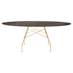 Kartell glänzender Tisch aus gealterter Bronze von Antonio Citterio
