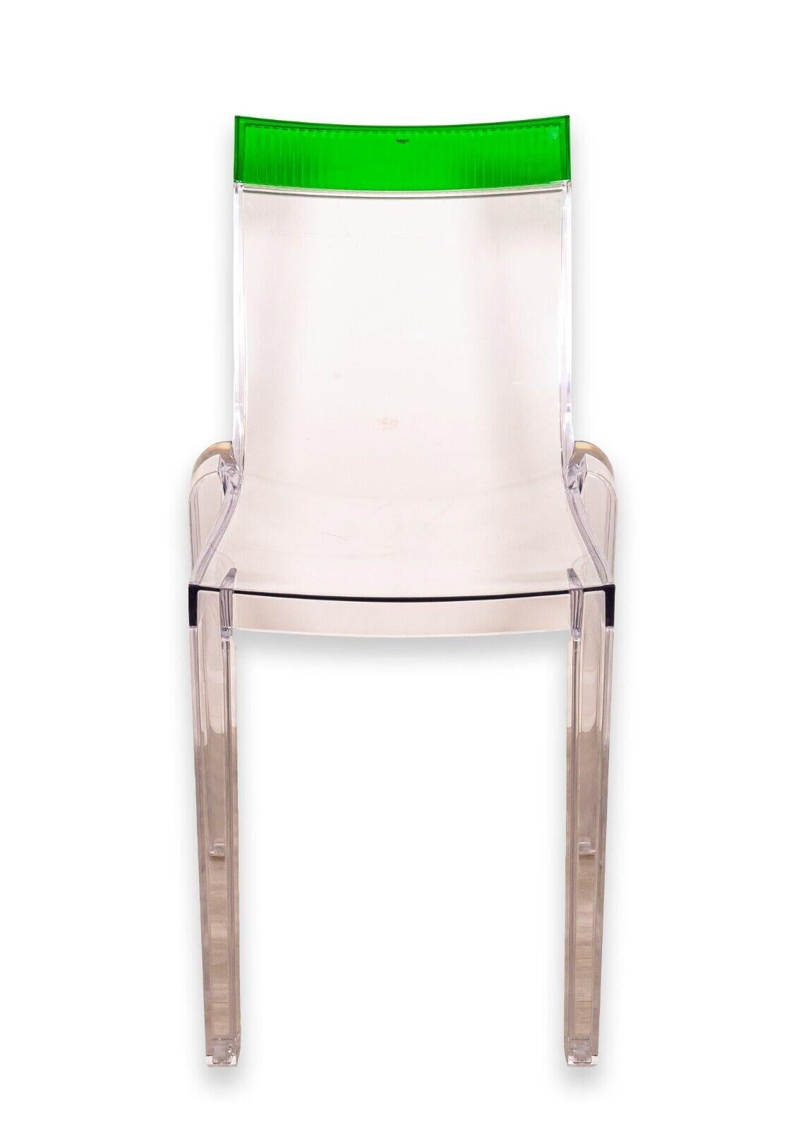 A Kartell Hi Cut by Philippe Starck contemporary chair. This lovely modern accent chair features a full molded acrylic construction with a strip of emerald green at the top of the chair. The Kartell tagging can be found on the top back of the chair