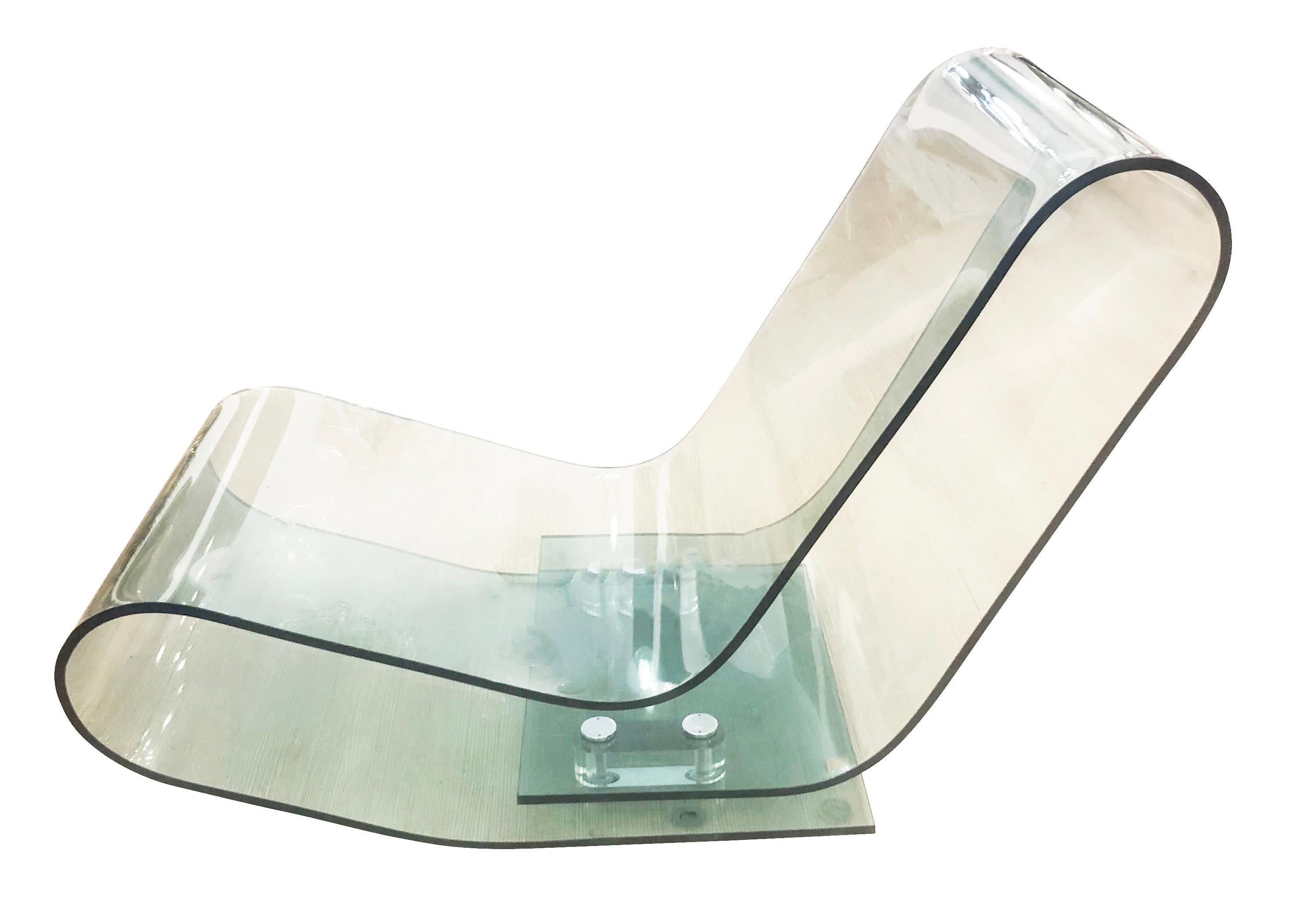 Lounge chair designed by Maarten Van Severen for Kartell in the 1990s. Made with a specialty plexiglass which allows for its unique design while maintaining support and comfort.

Condition: Excellent vintage condition, minor wear consistent with