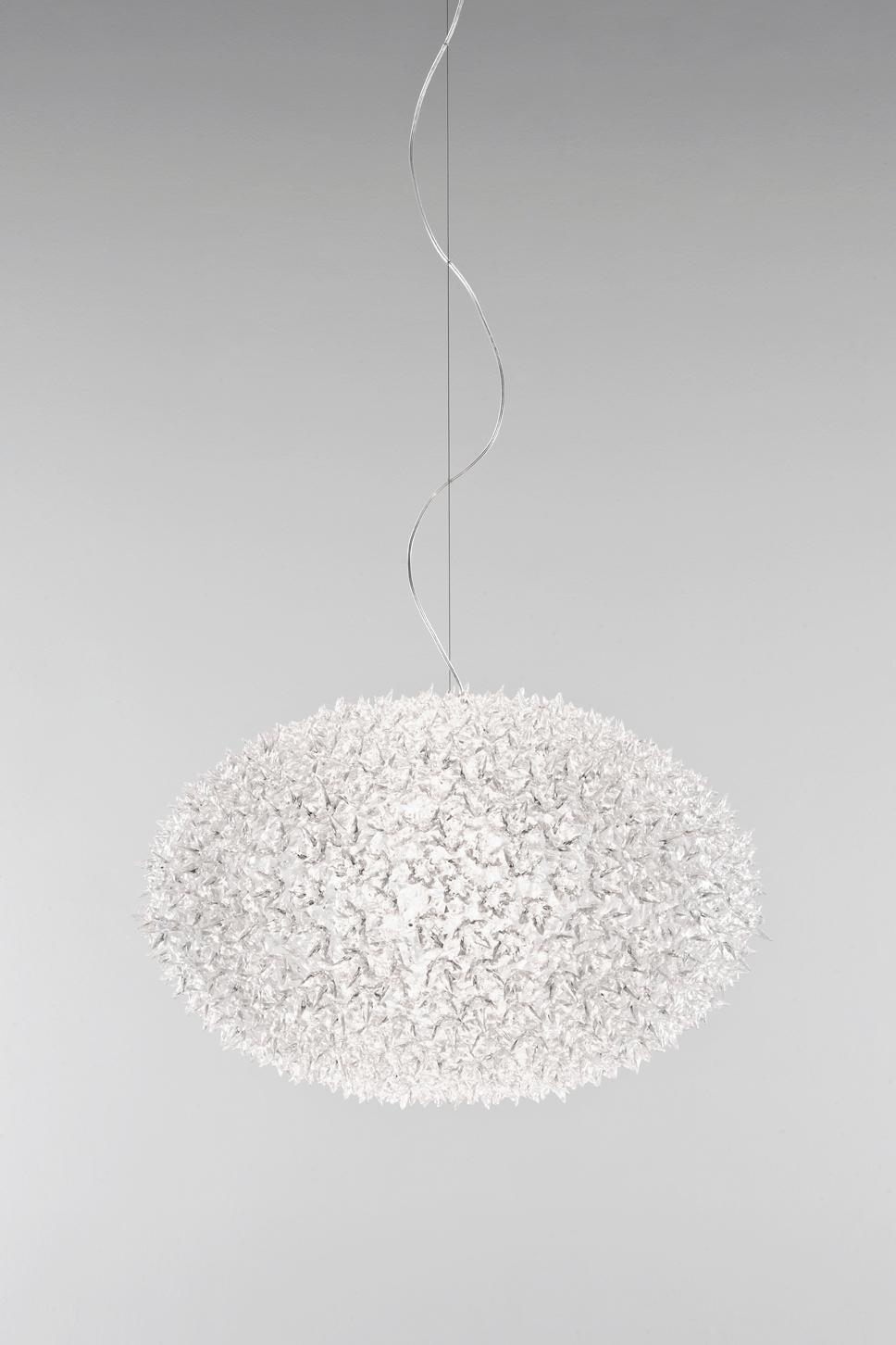The Bloom New lamp family with its elliptical shape and distinctive original structure covered by sparkling polycarbonate flowers as pure and precious as crystal in hanging. As delicate as a spring bouquet, Bloom lights offer new and sophisticated