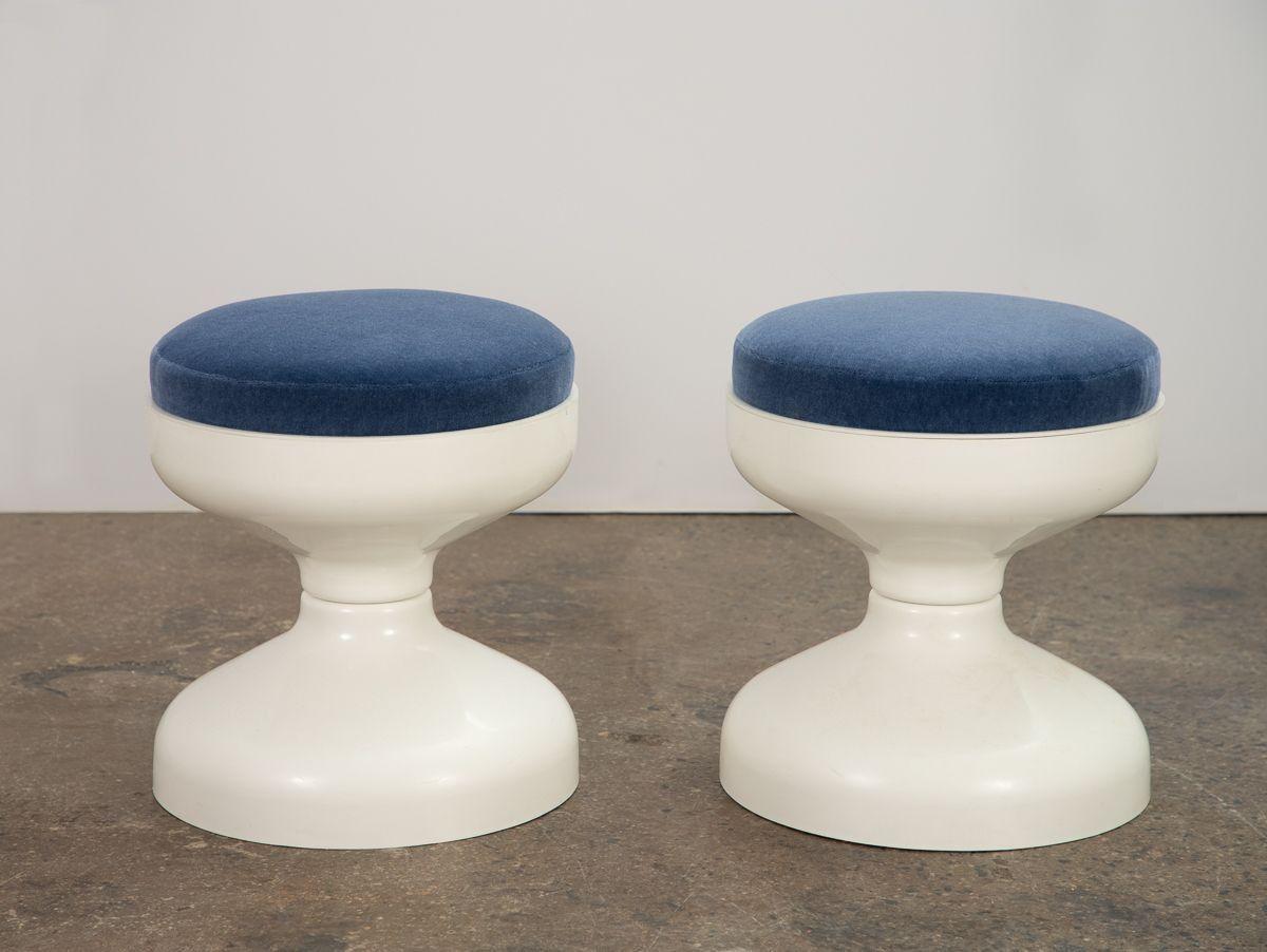 1960s Rocchetto stool, designed by Achille and Pier Giacomo Castiglioni for Kartell. A fun and groovy hourglass form topped by a plush cushion. Ivory ABS plastic base is smooth and free of any cracks. Refreshed with new upholstery in blue mohair