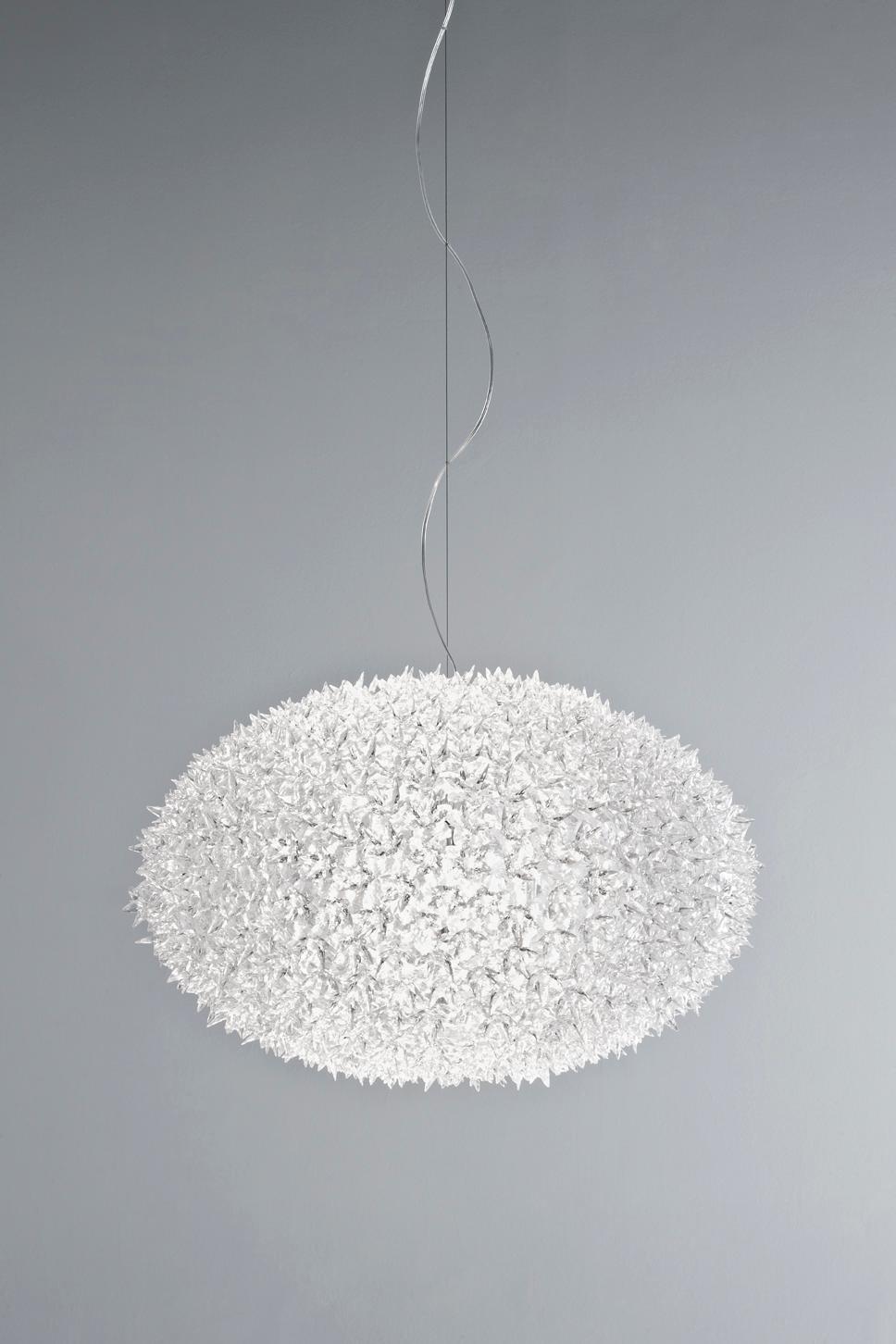 The Bloom New lamp family with its elliptical shape and distinctive original structure covered by sparkling polycarbonate flowers as pure and precious as crystal in hanging. As delicate as a spring bouquet, Bloom lights offer new and sophisticated