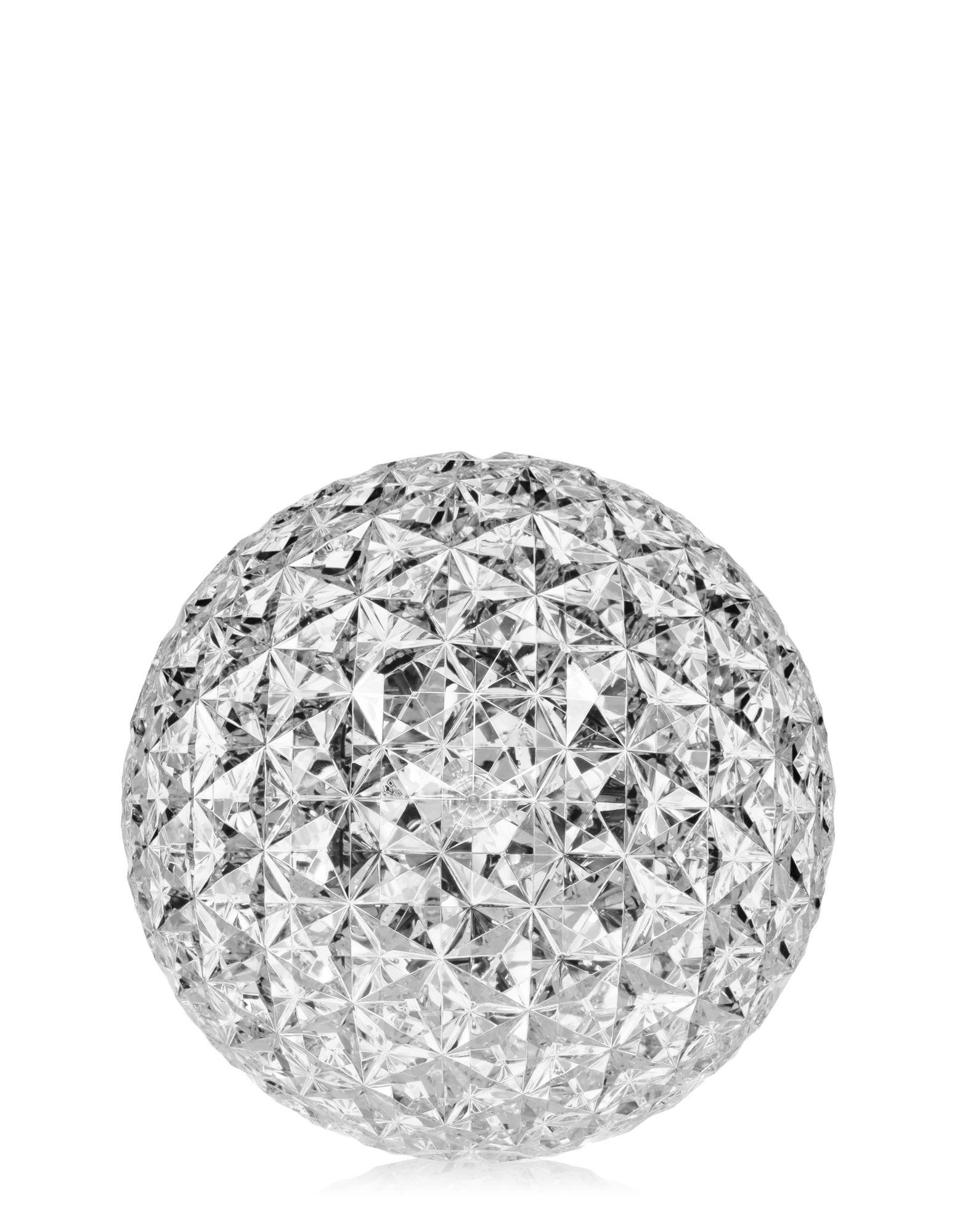Planet lamp in crystal. Its special feature that is the shape of its slightly elliptical diffuser. Its transparent surface, which is many-sided both inside and out, creates a rich tapestry of reflections.

Dimensions: Height 11 in, diameter 12.2