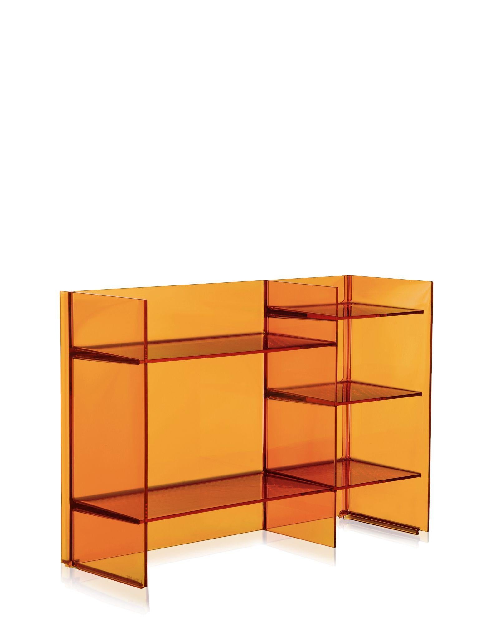 Multi-shaped and multi-purpose shelving system, stackable and modular, offering the possibility of creating a variety of geometric and chromatic compositions. This accessory can play the dual role as both container and room divider. IT IS a