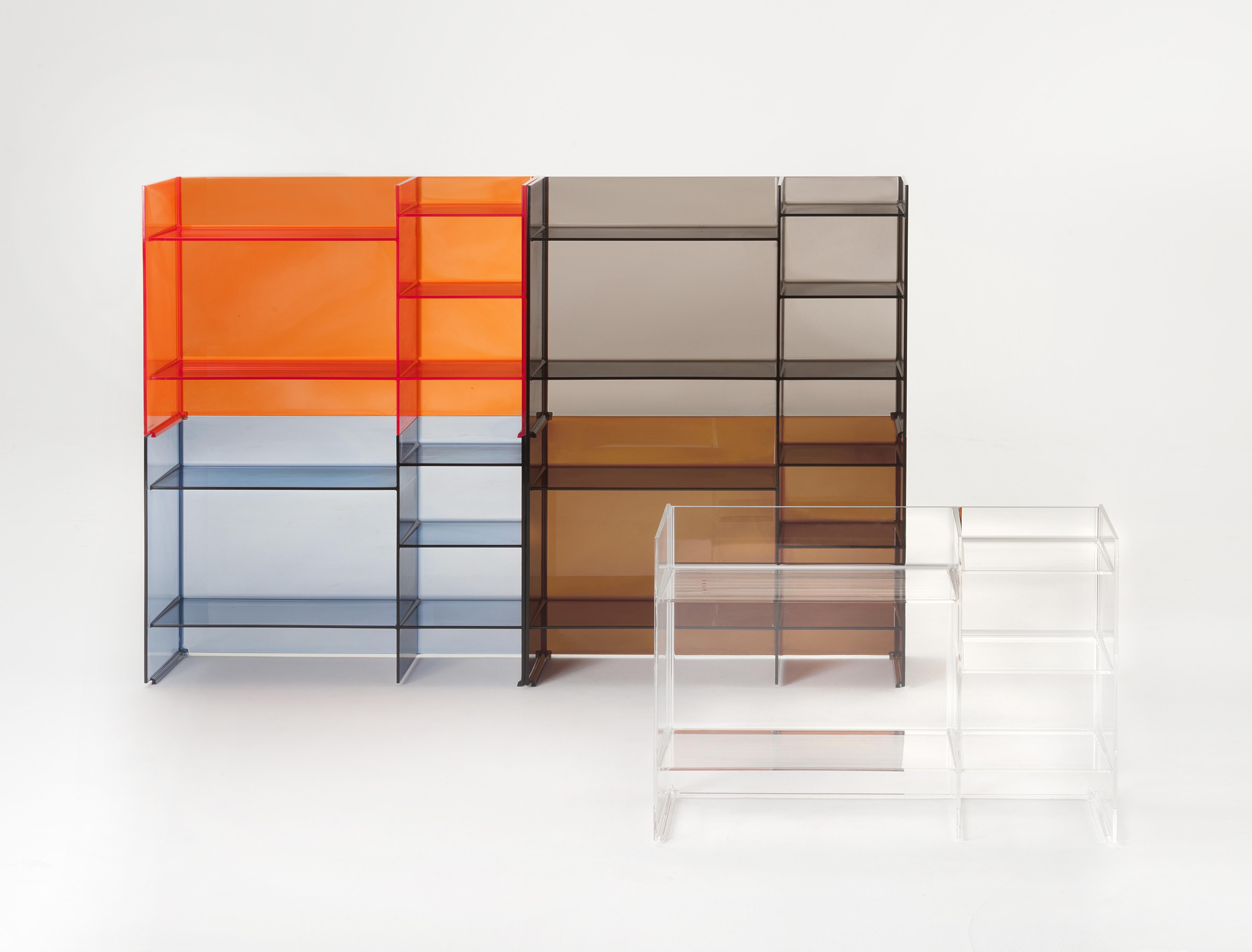 Multi-shaped and multi-purpose shelving system, stackable and modular, offering the possibility of creating a variety of geometric and chromatic compositions. This accessory can play the dual role as both container and room divider. It is a