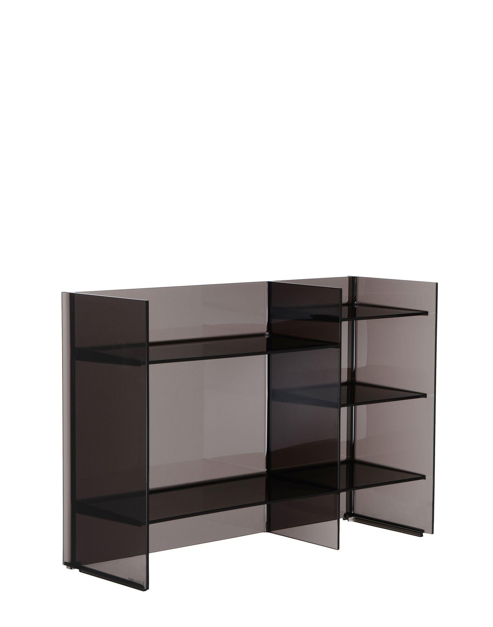Multi-shaped and multi-purpose shelving system, stackable and modular, offering the possibility of creating a variety of geometric and chromatic compositions. This accessory can play the dual role as both container and room divider. It is a