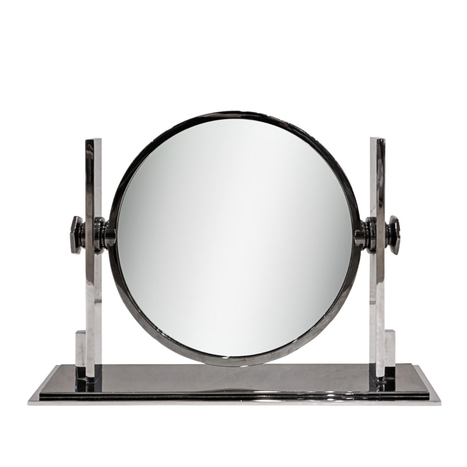 Beautifully crafted iconic double sided vanity mirror in polished gunmetal and chrome with magnifier on one side and regular mirror on the other by Karl Springer, American 1980's.  It is rare to see this mirror in these metals.  It was typically
