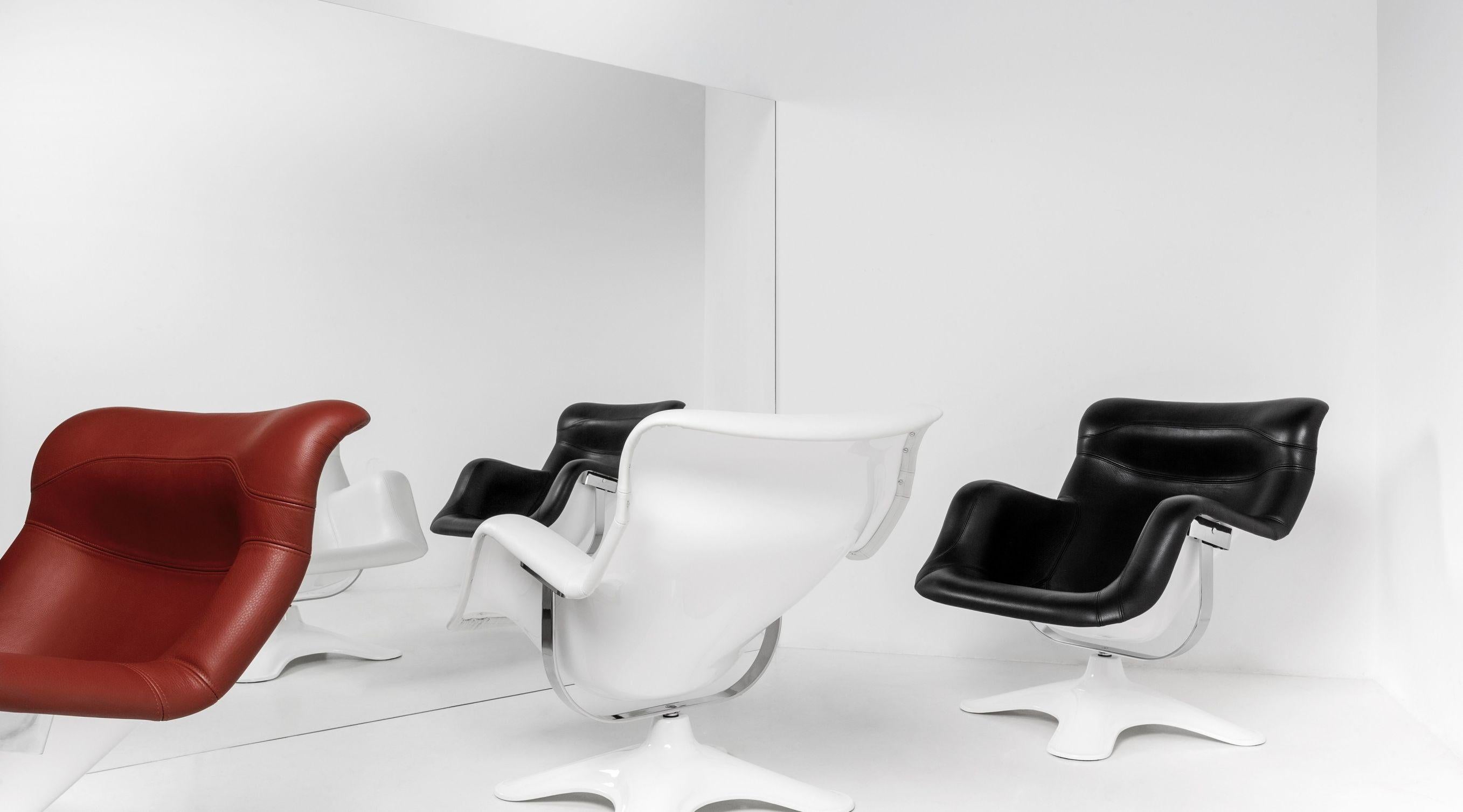Karuselli lounge chair with red leather by Yrjö Kukkapuro & Artek. Distinct in style and exceptionally comfortable, the Karuselli lounge chair exemplifies designer Yrjö Kukkapuro’s interest in achieving ultimate comfort through a union of function,