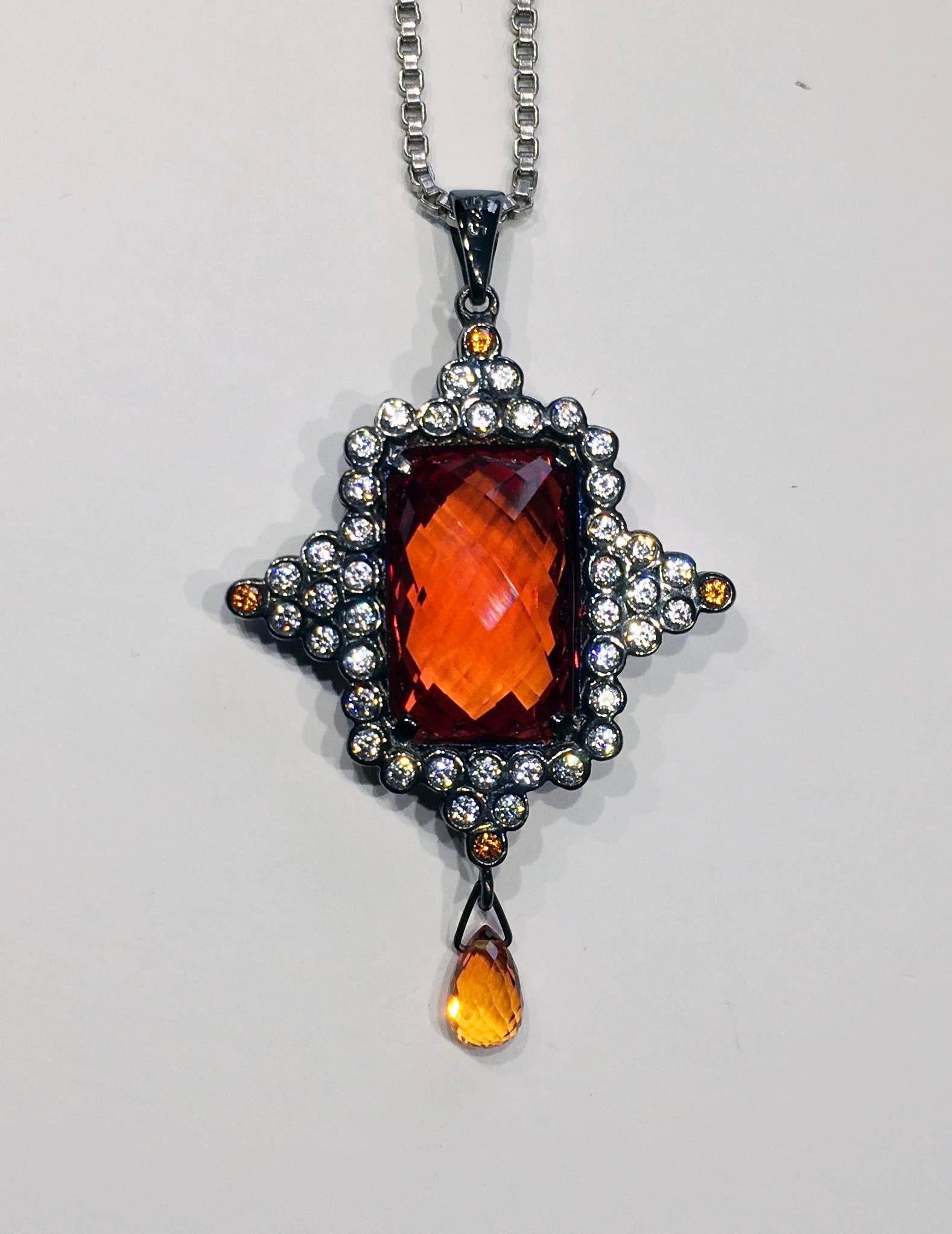 A Checkerboard cut Orange Sapphire Pendant Set in Blackened Silver For Sale 1