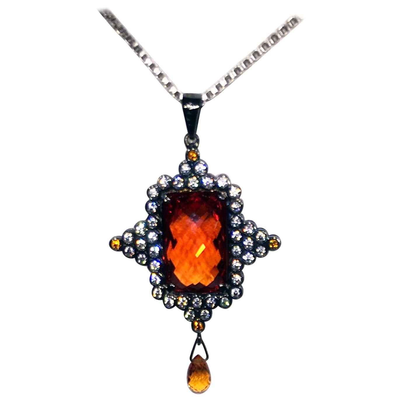 A Checkerboard cut Orange Sapphire Pendant Set in Blackened Silver For Sale