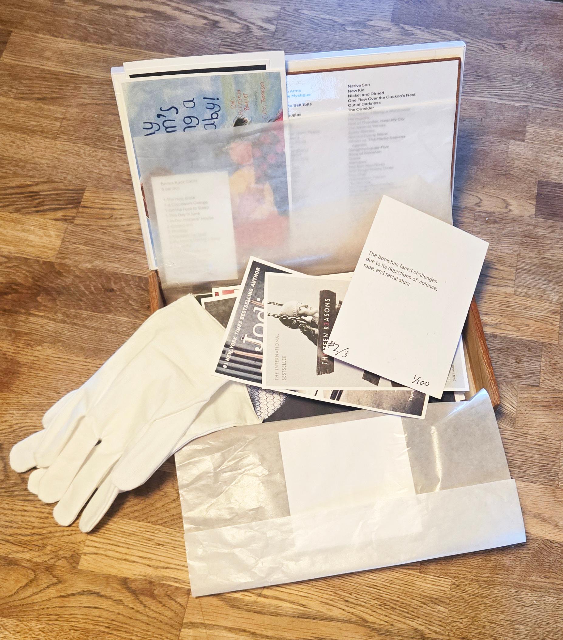 As Seen at Art on Paper Art Fair 2024 at The Mannix Project East Hampton NY
Box of BANNED (Books) contains 100 banned books. On the front of each piece is the book cover. On the flip-side is the reason the book is banned/challenged.

Each (cigar)
