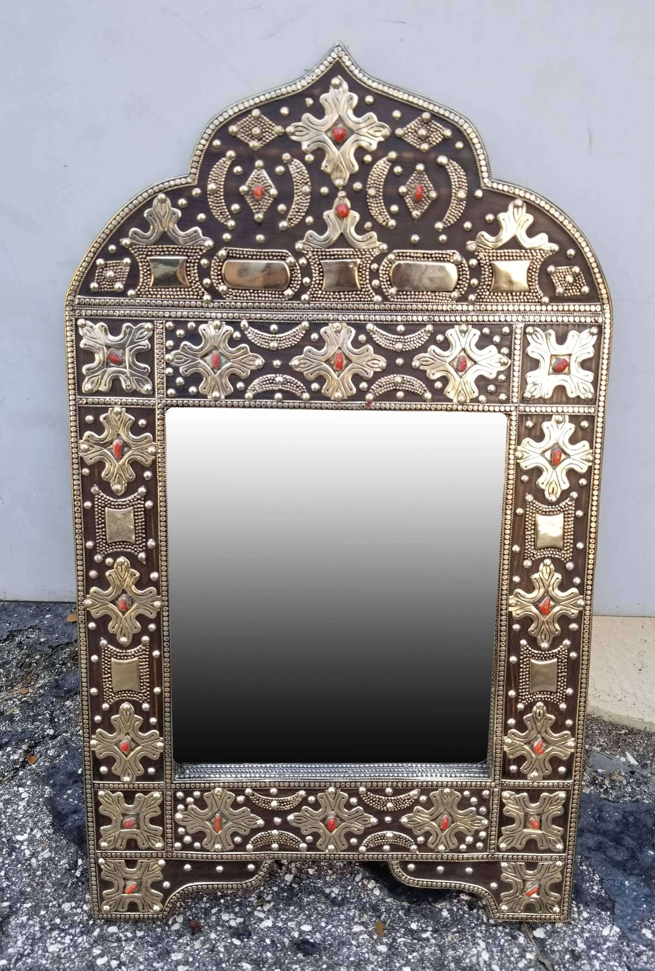 Large metal inlaid and camel bone Moroccan mirror. Made in the city of Marrakech. Arched shape measuring approximately 21