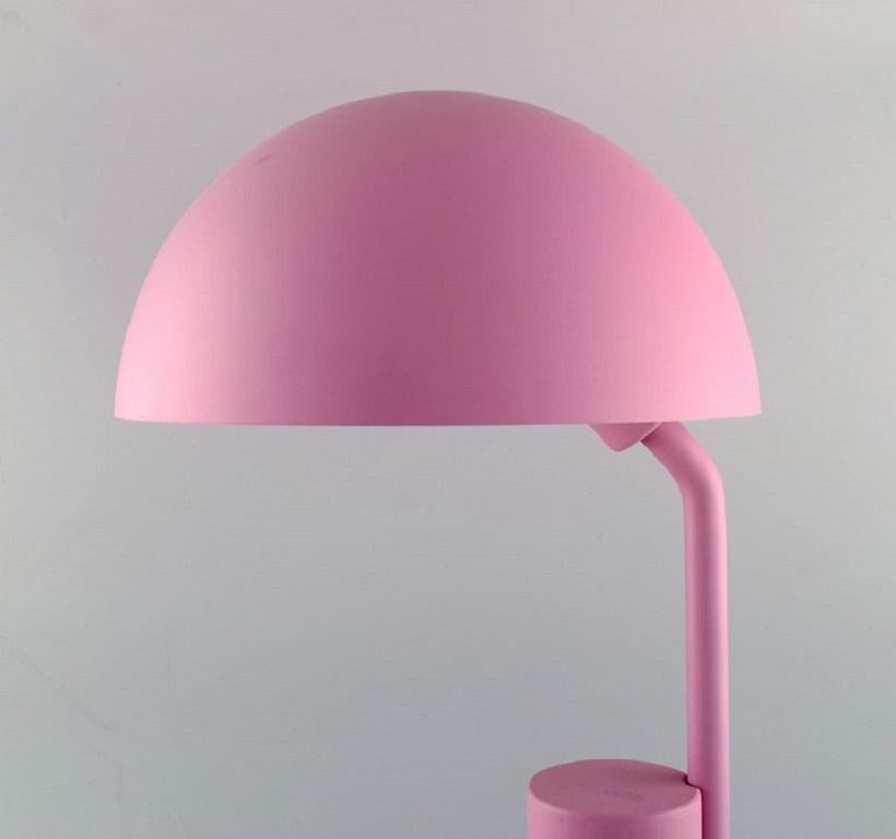 KaschKasch for Normann Copenhagen. Cap table lamp in pink lacquered steel with an adjustable lampshade. 
21st century.
Measures: 49 x 28 cm.
In excellent condition.
