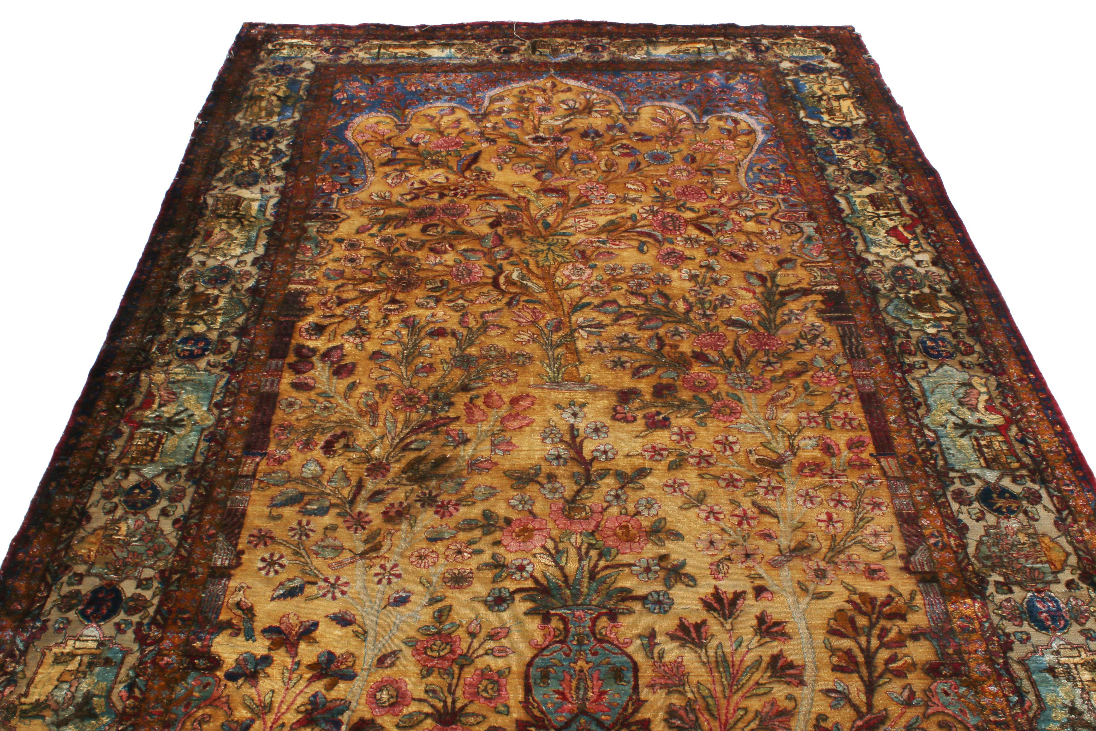 Originating from Persia between 1880-1900, this traditional antique Kashan rug utilizes brilliant hand knotted silk to accent a variety of lively colourways complementing its size and intricacy. The bold but graceful floral and animal imagery of the
