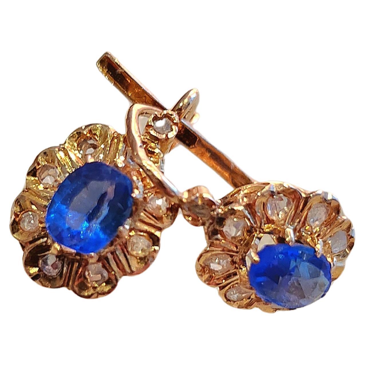 Antique french earrings with natural kashmire sapphire in velvety blue colour with an estimate total weight of 1.80 carats flanked with little rose cut diamonds in 18k gold finest hall marked with french eagle head gold standard for 18k dates back