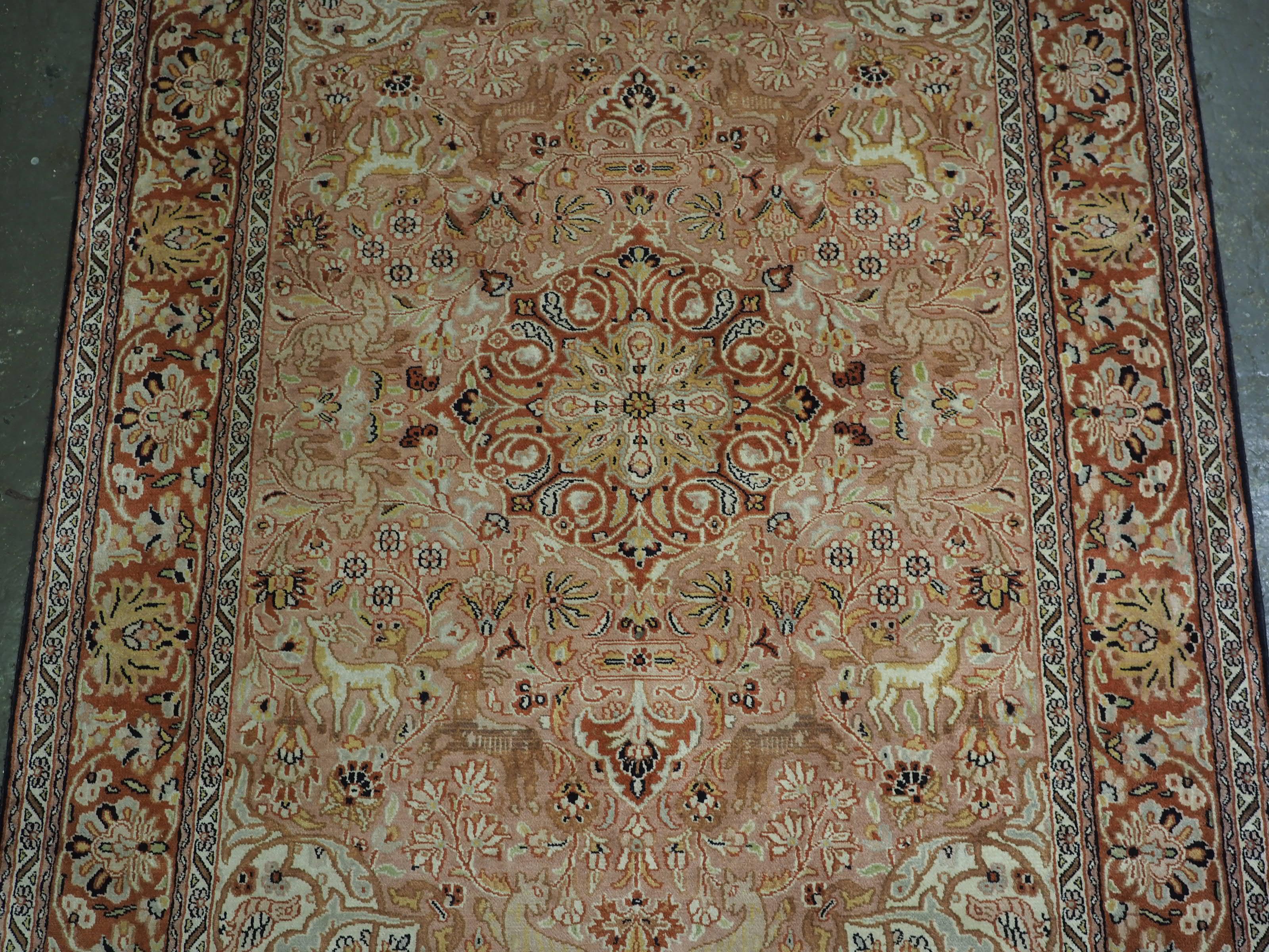 Kashmir silk rug with a small medallion design in garden of animals & flowers. In Good Condition For Sale In Moreton-In-Marsh, GB