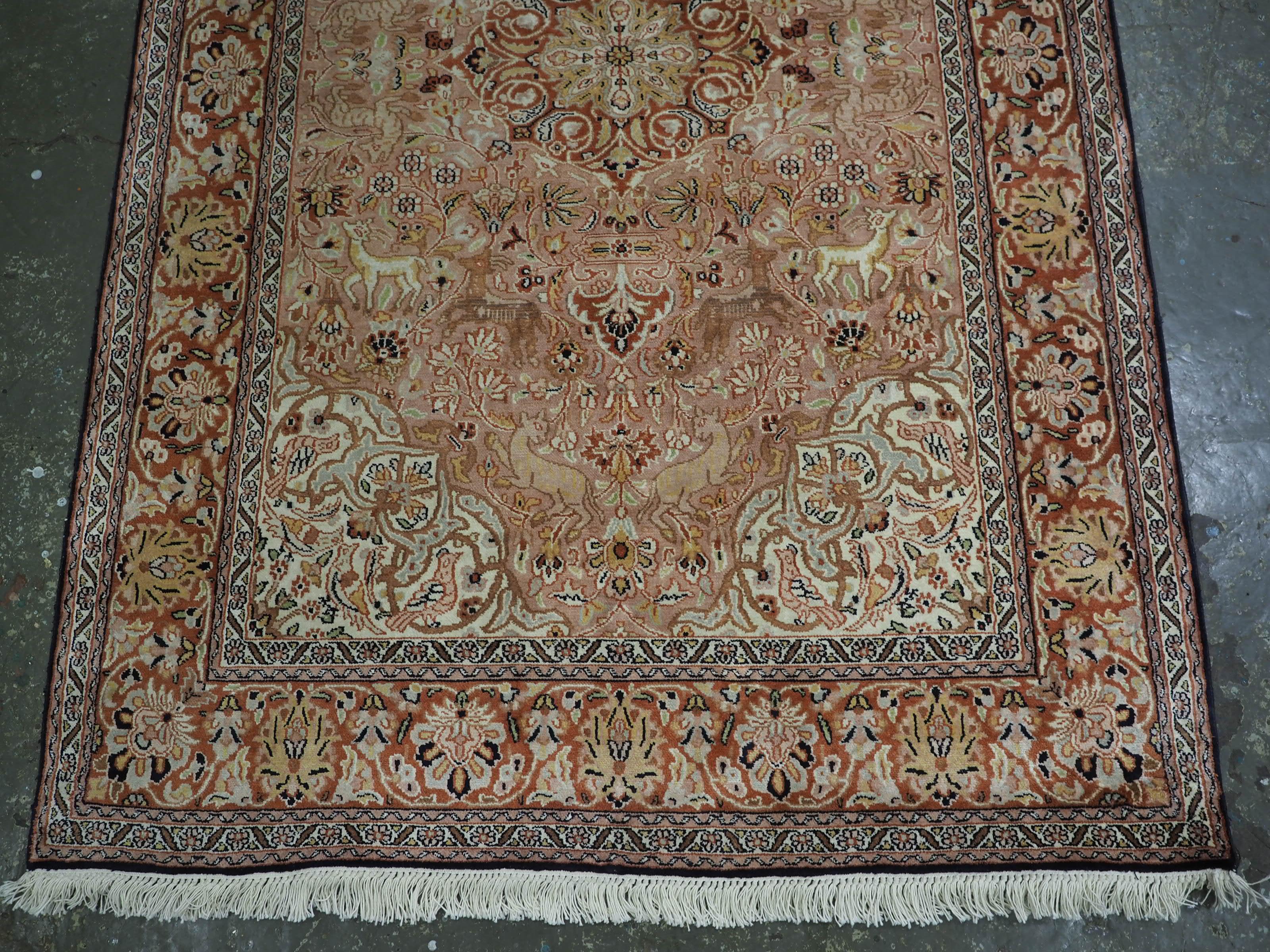 Early 20th Century Kashmir silk rug with a small medallion design in garden of animals & flowers. For Sale