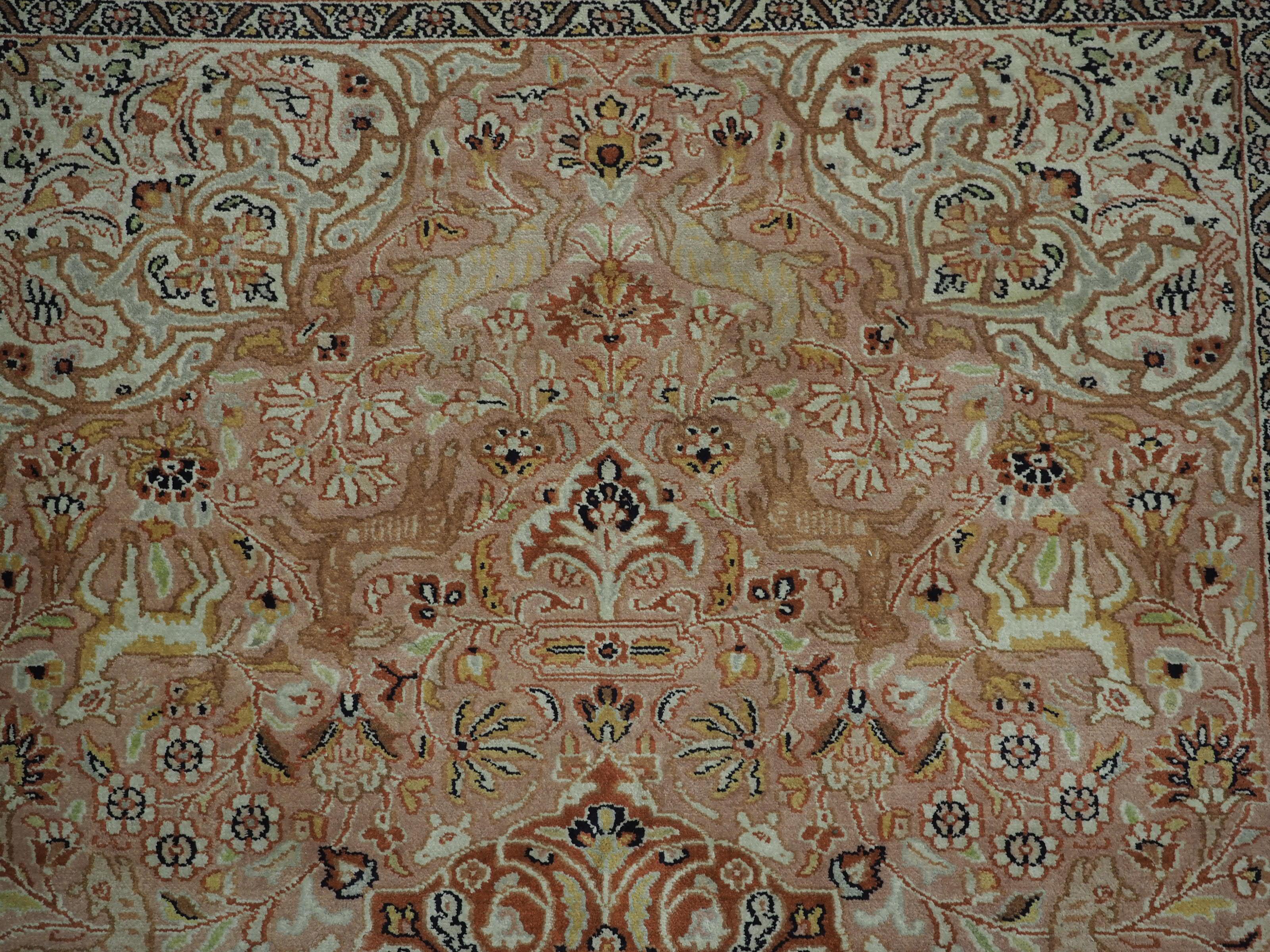 Kashmir silk rug with a small medallion design in garden of animals & flowers. For Sale 1