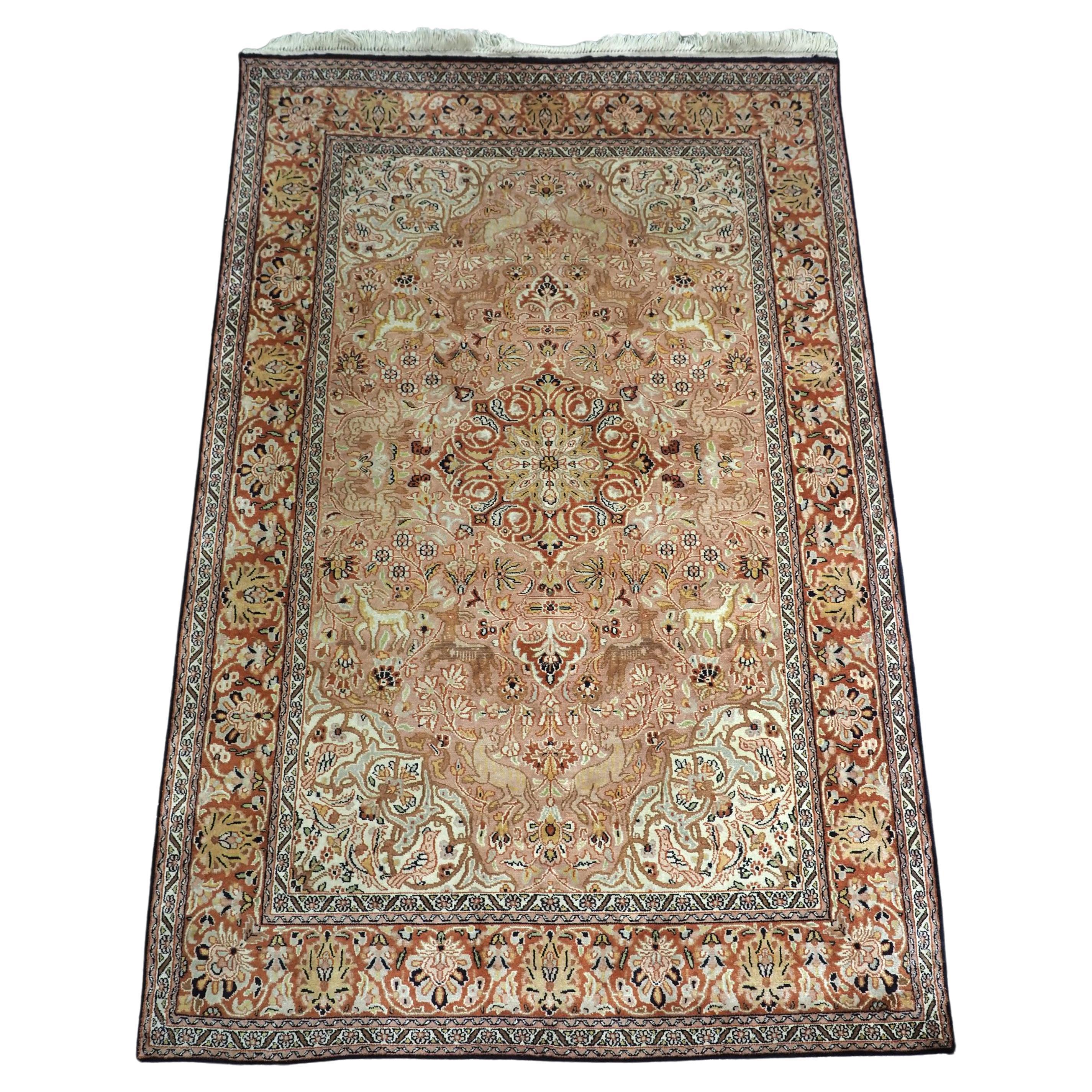 Kashmir silk rug with a small medallion design in garden of animals & flowers. For Sale